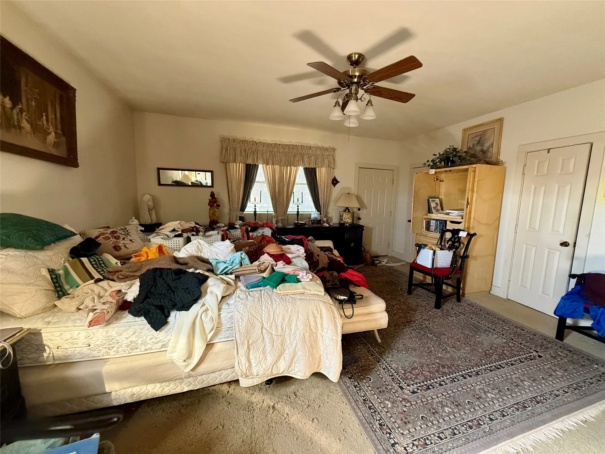 Bedroom featuring a ceiling fan