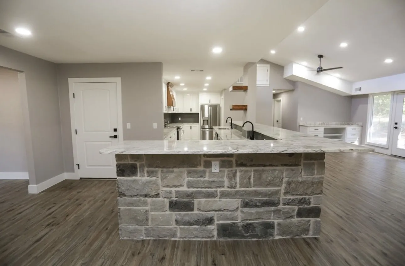 Kitchen featuring dark wood finished floors, recessed lighting, appliances with stainless steel finishes, ceiling fan, and light stone counters
