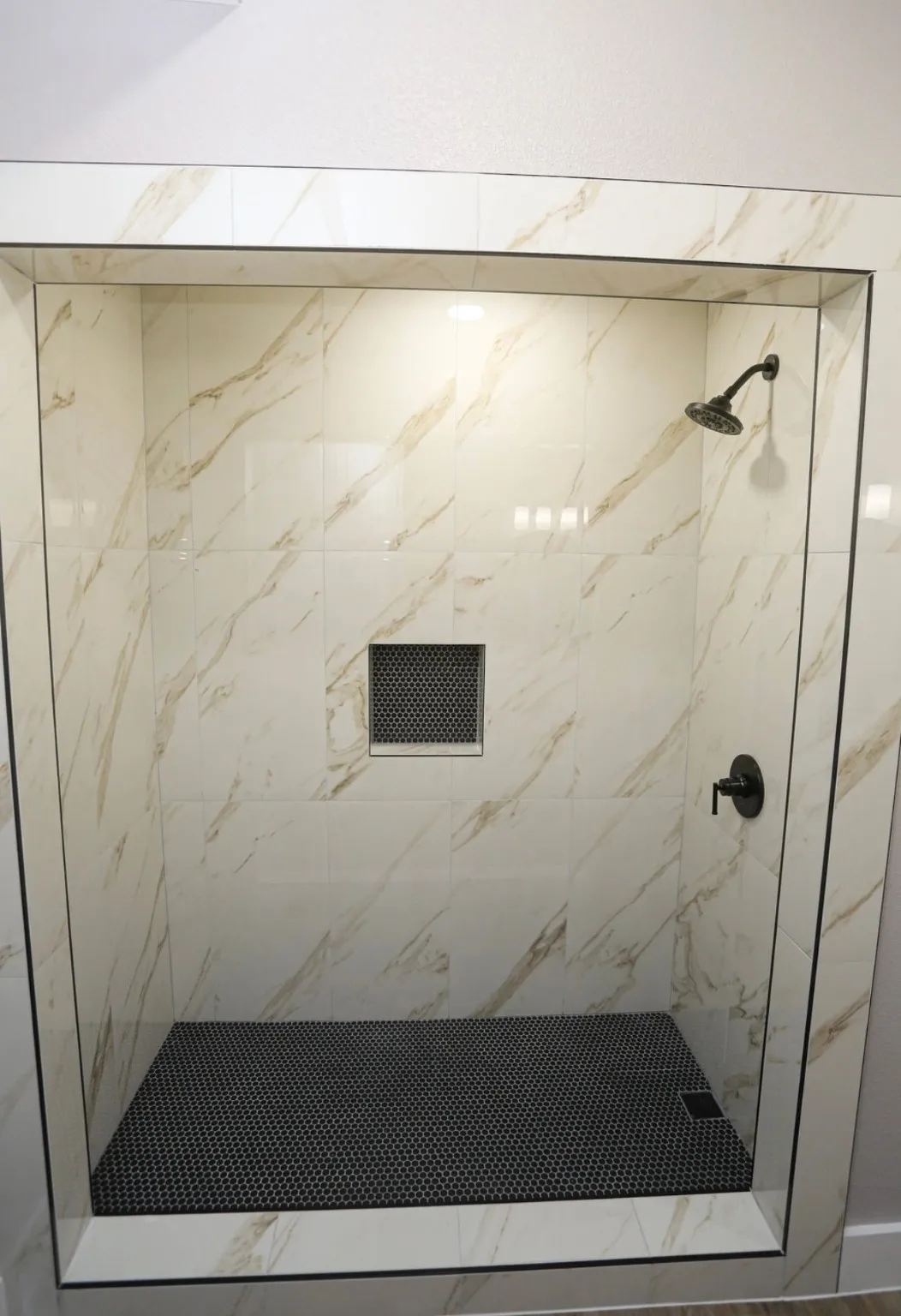 Full bathroom featuring a stall shower