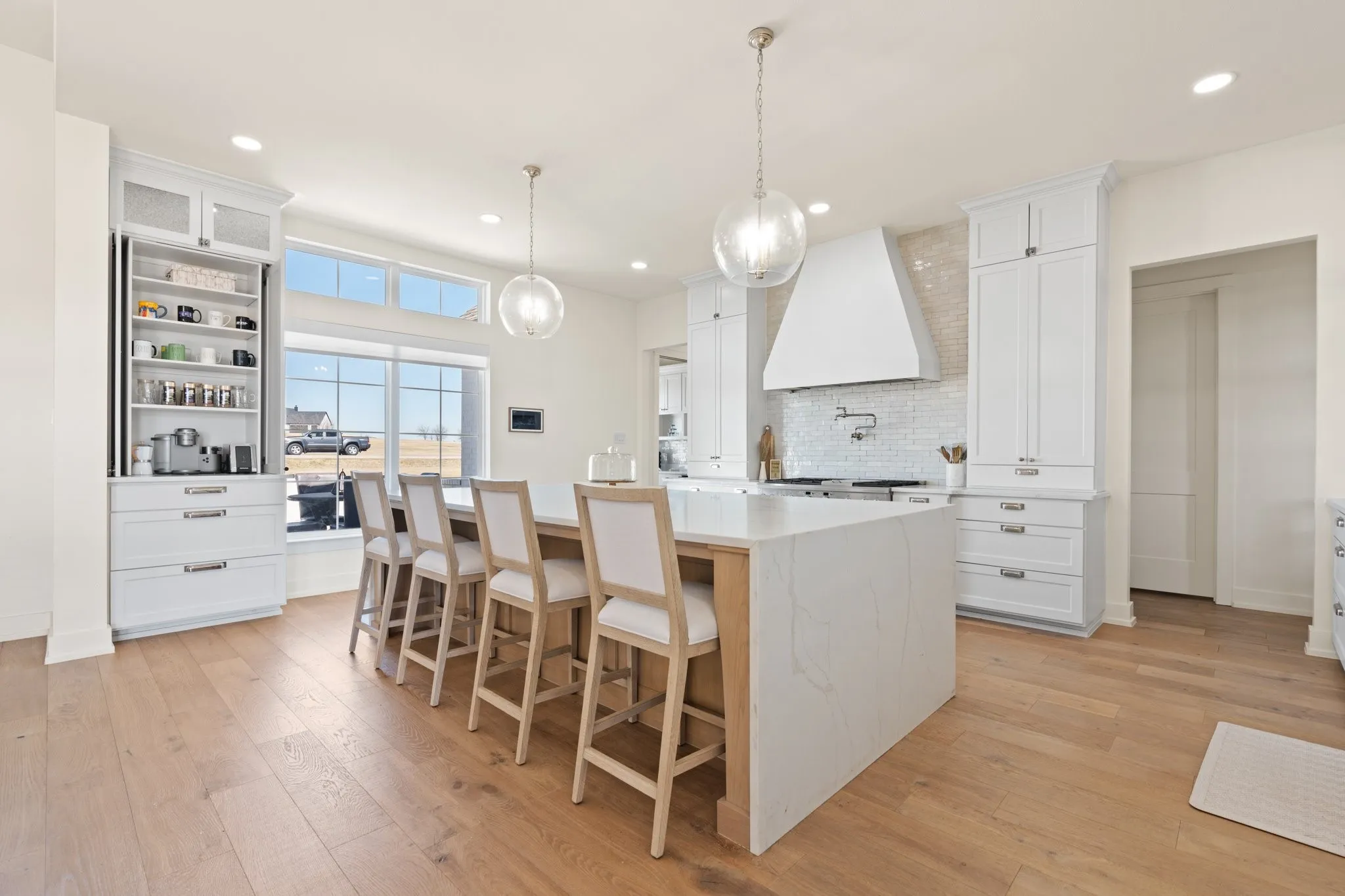 Elegant kitchen featuring a stylish coffee bar with a seamless, built-in cabinet design—offering the option to elegantly conceal the space for a sleek and sophisticated look