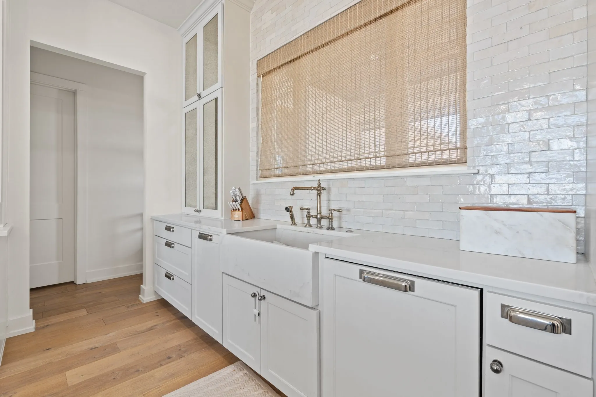 Built-in dishwasher blended seamlessly with custom cabinetry for a sleek, sophisticated kitchen design.