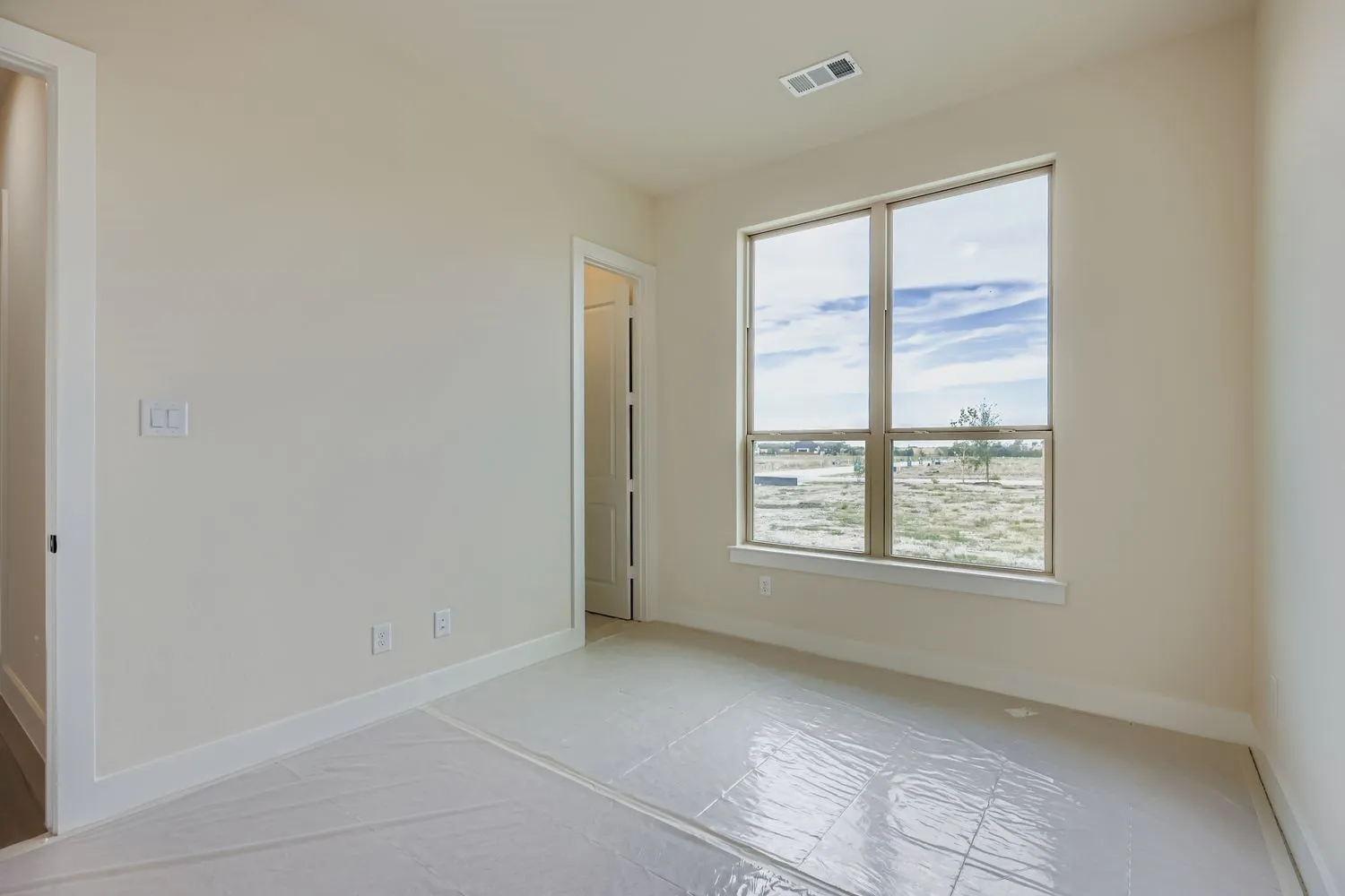 Unfurnished room featuring baseboards