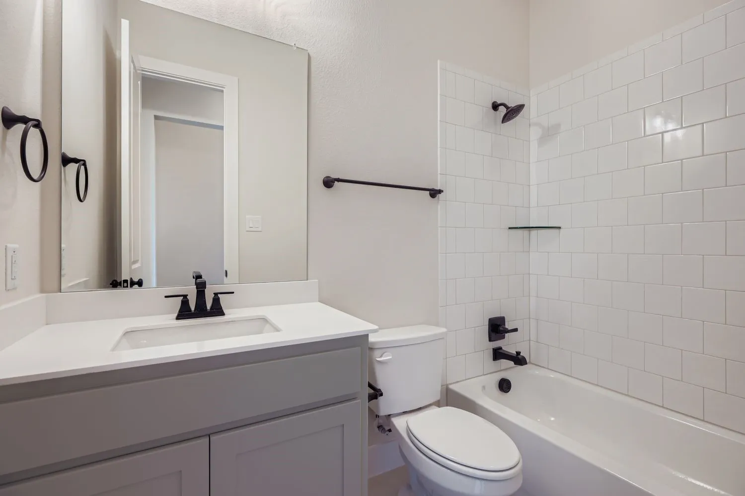 Bathroom with shower / tub combination and vanity