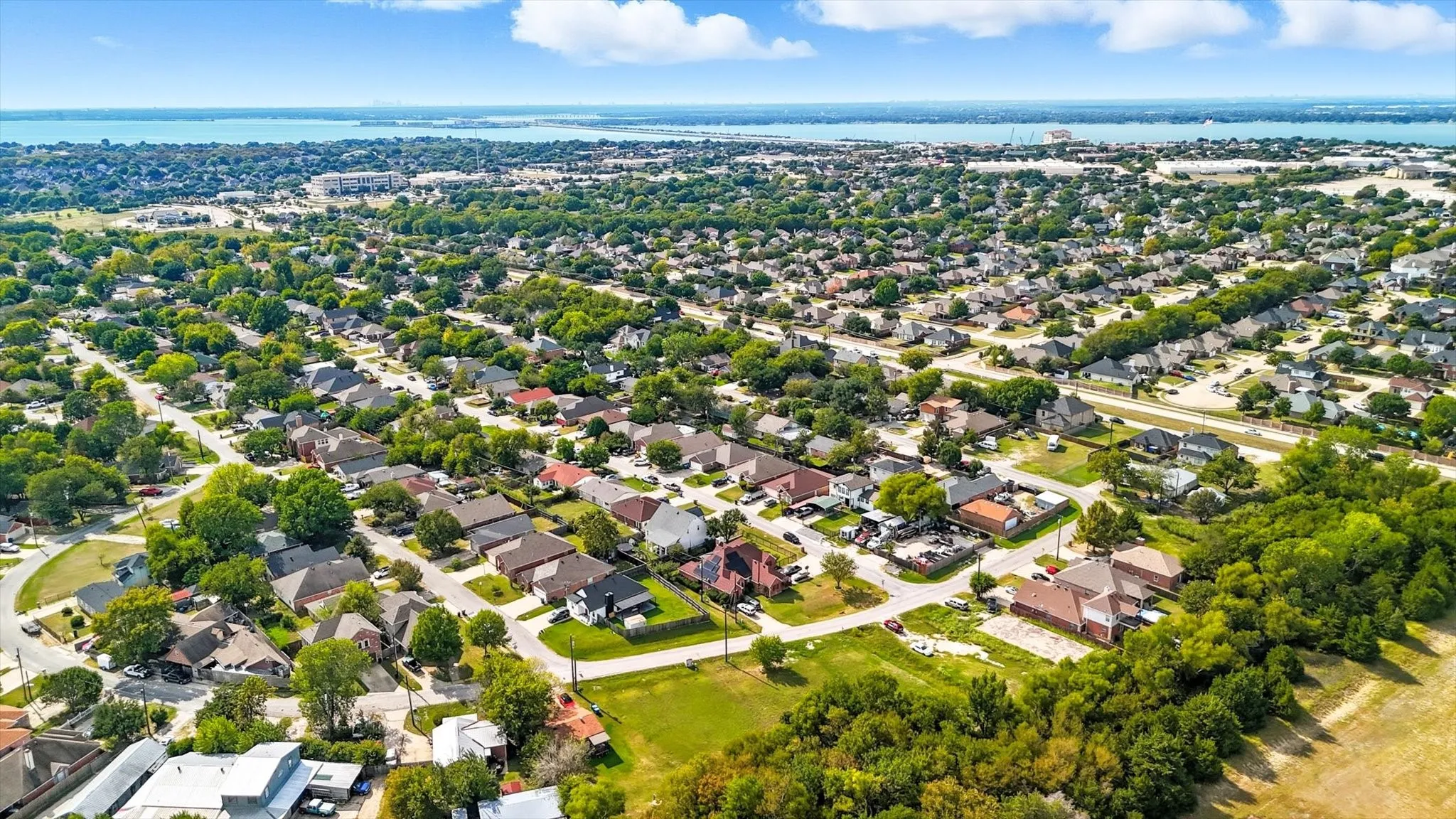Aerial overview of property's location featuring nearby suburban area
