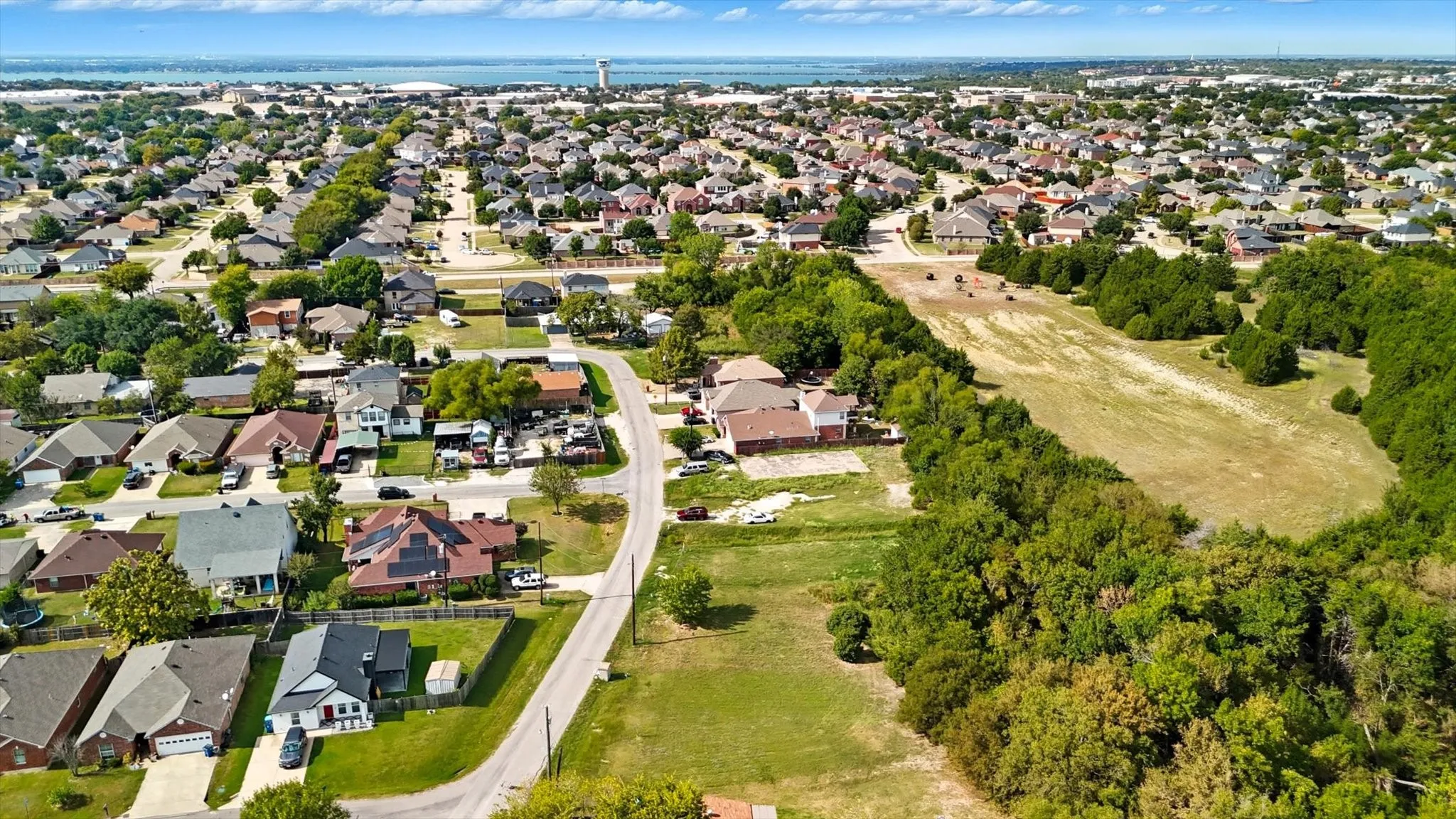 Aerial view of property's location featuring nearby suburban area