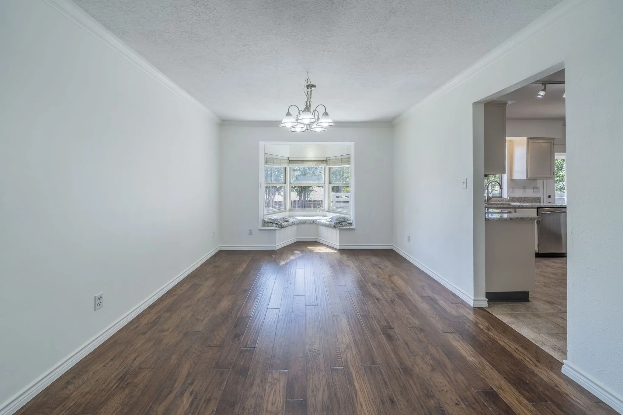 Large dining area with a bay window and window seating.