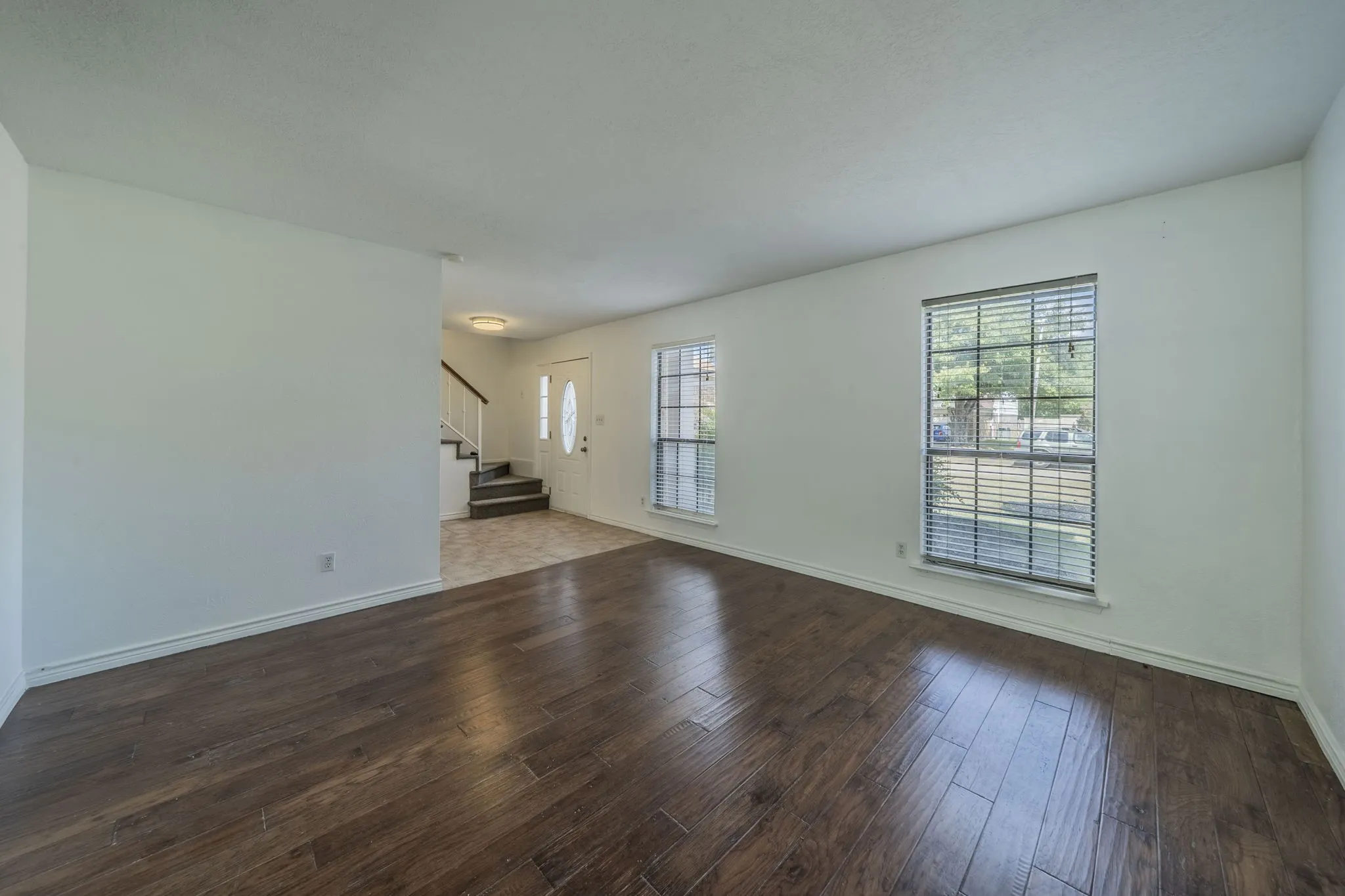 Enter the front door to the spacious living area in front.