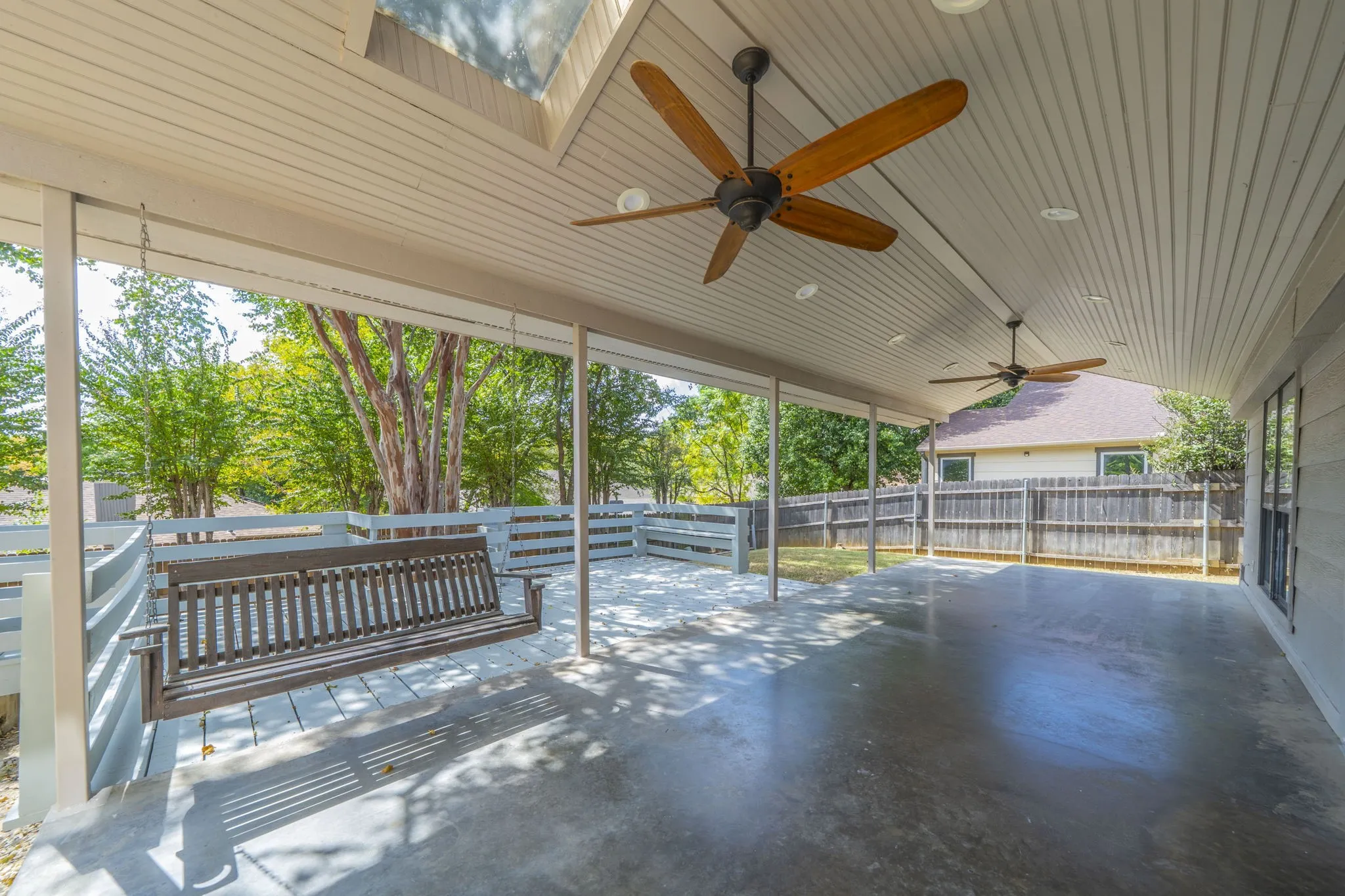 An amazing patio and deck out back. Notice  the patio portion is covered and the deck is open.
