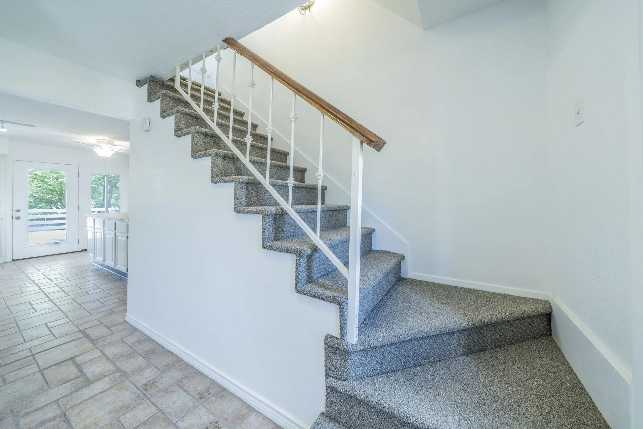As you enter the front door to the right of the front door is the stairs to the upstairs bedrooms.