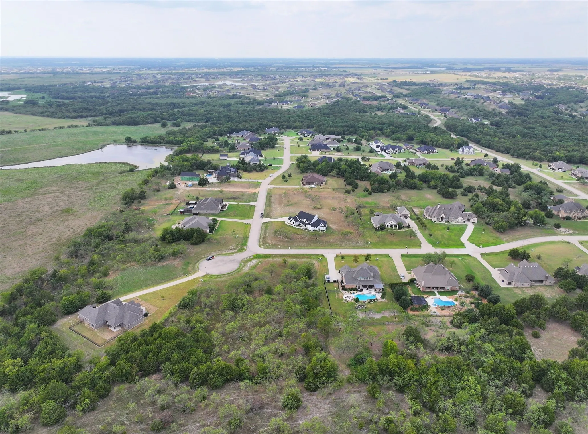 Picture your dream home here on this lovely lot with mature trees for all the privacy that you desire