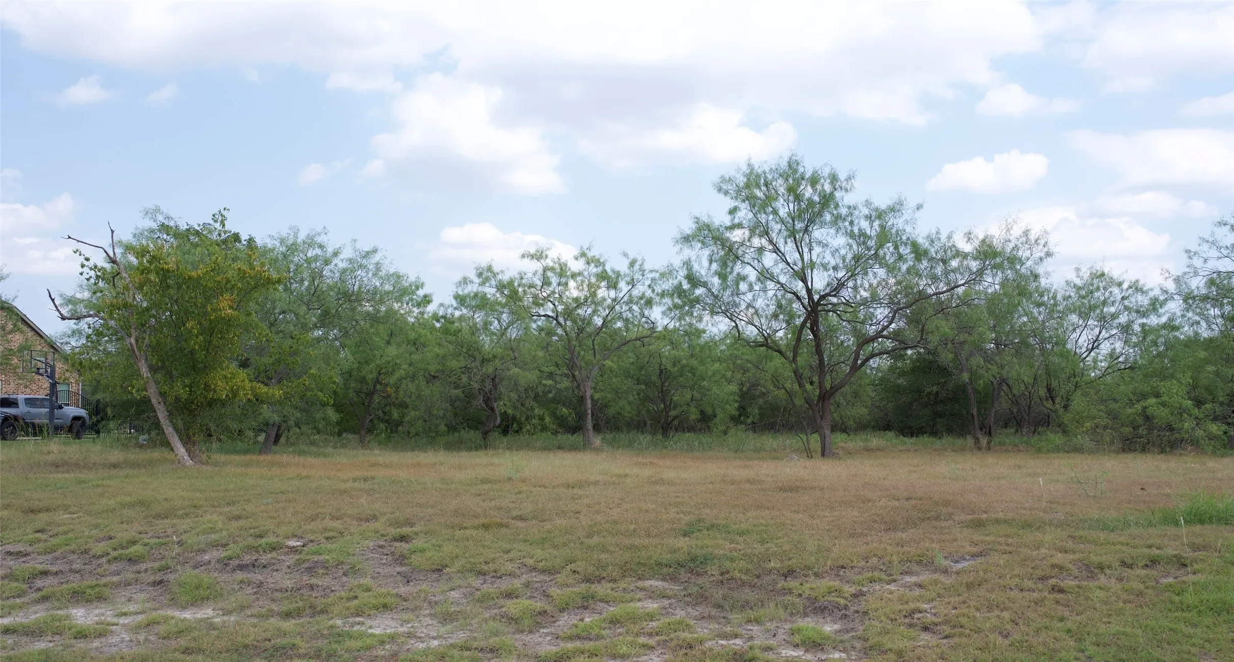 Tree lined lot provides ample privacy for your dream home