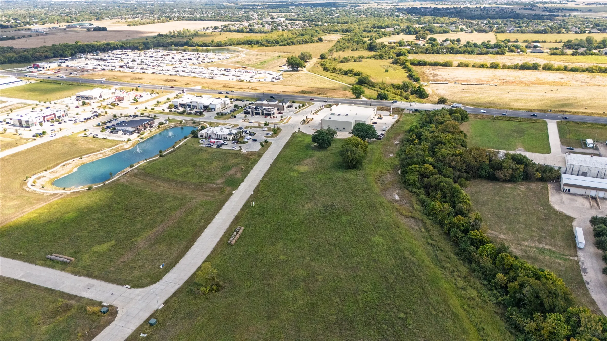 Aerial overview of property's location with a nearby body of water