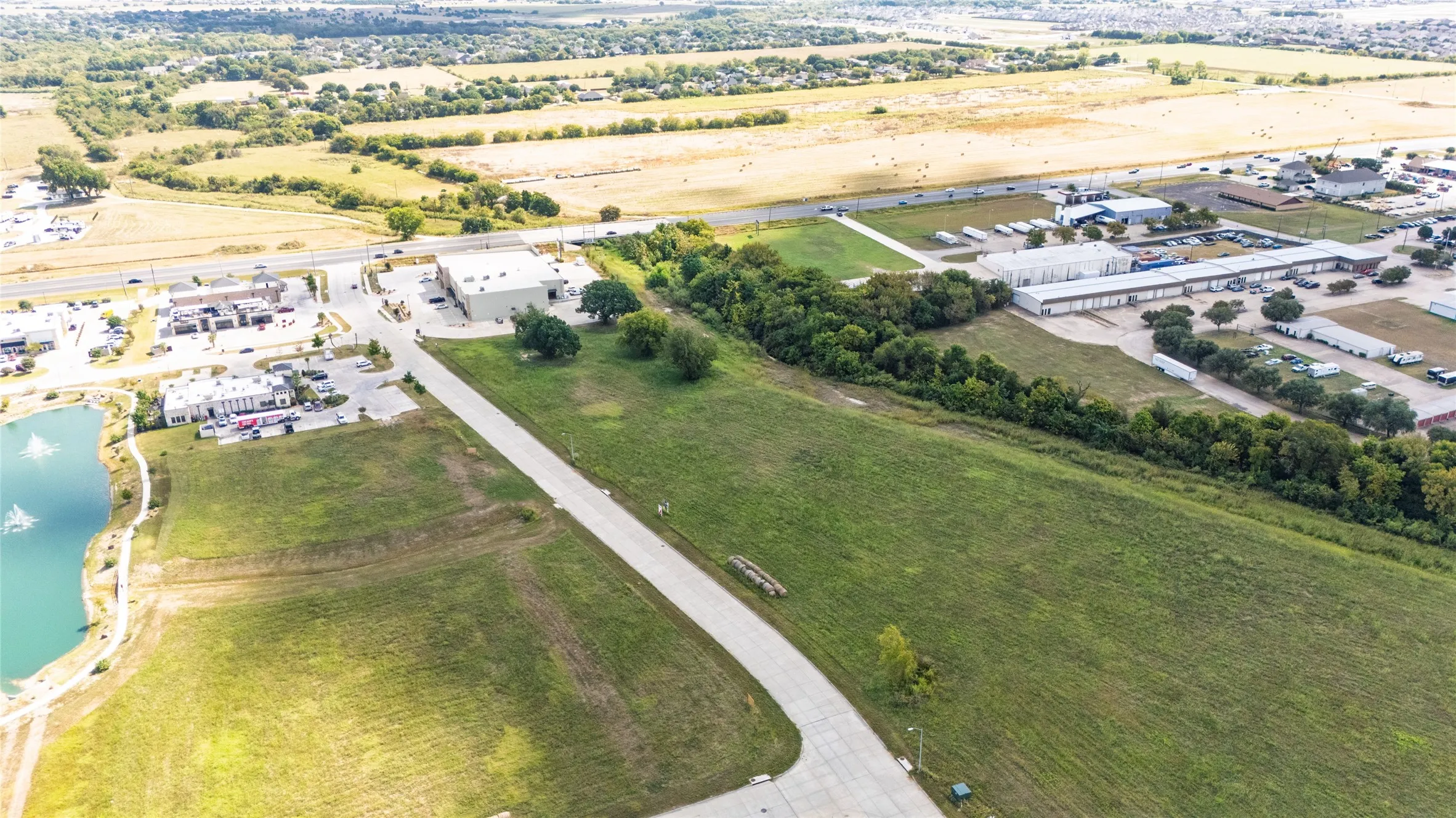 Aerial view of property's location with a large body of water