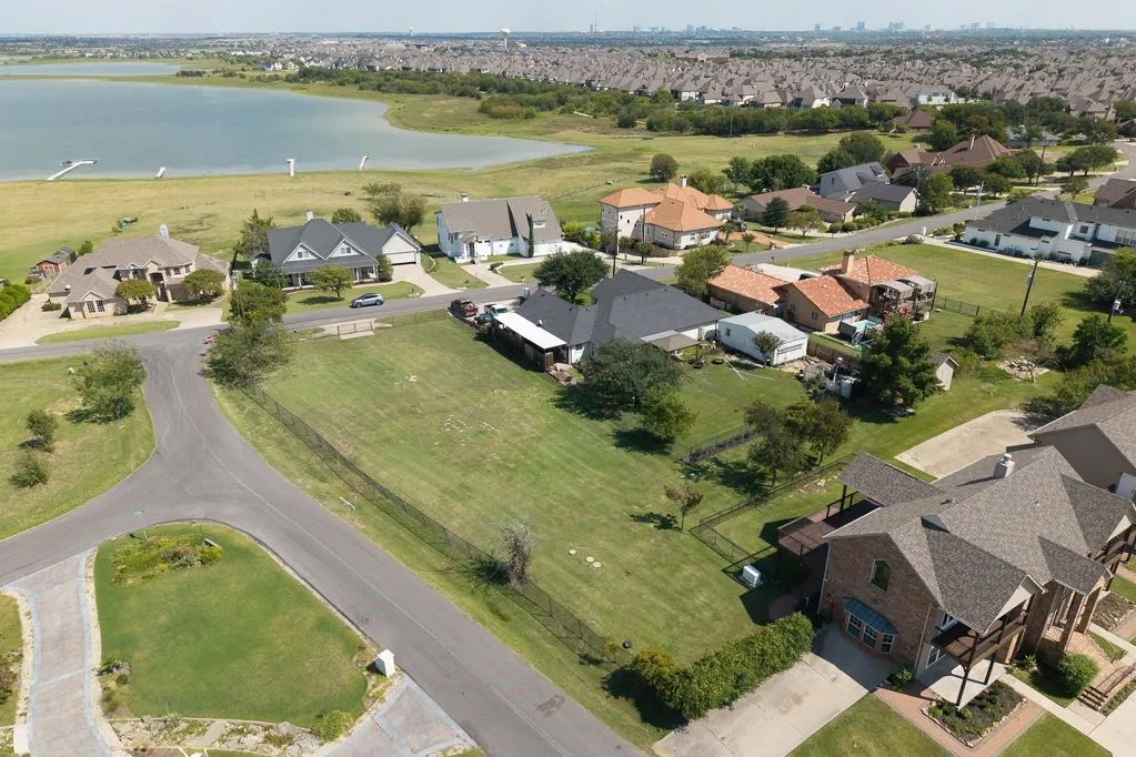 View of property location with nearby suburban area and a large body of water