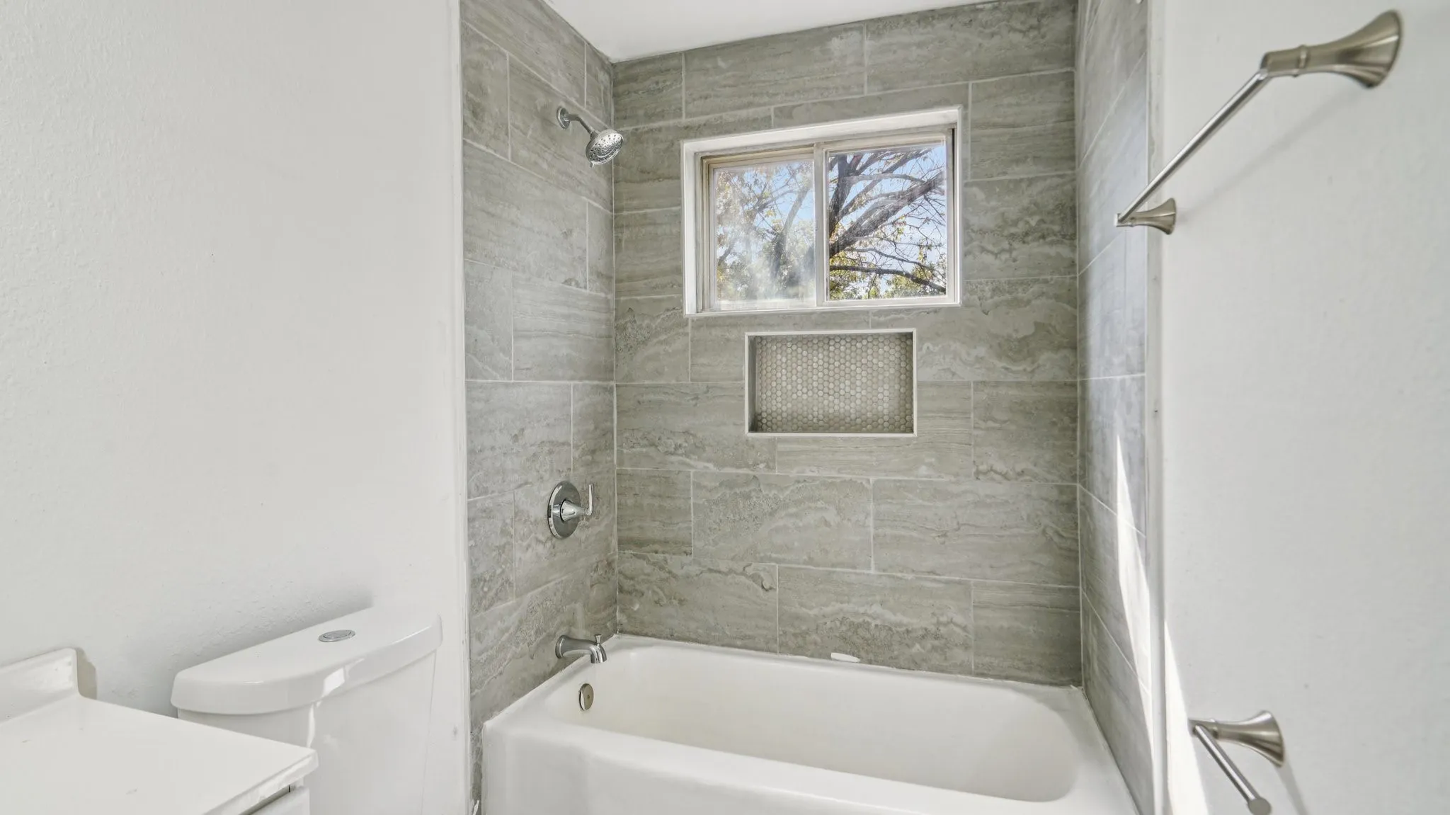 Bathroom with washtub / shower combination and vanity