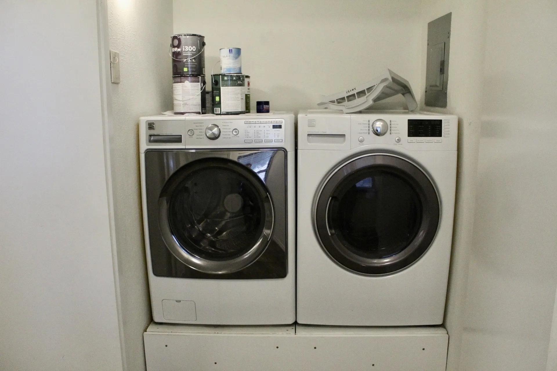 Washroom featuring separate washer and dryer and electric panel