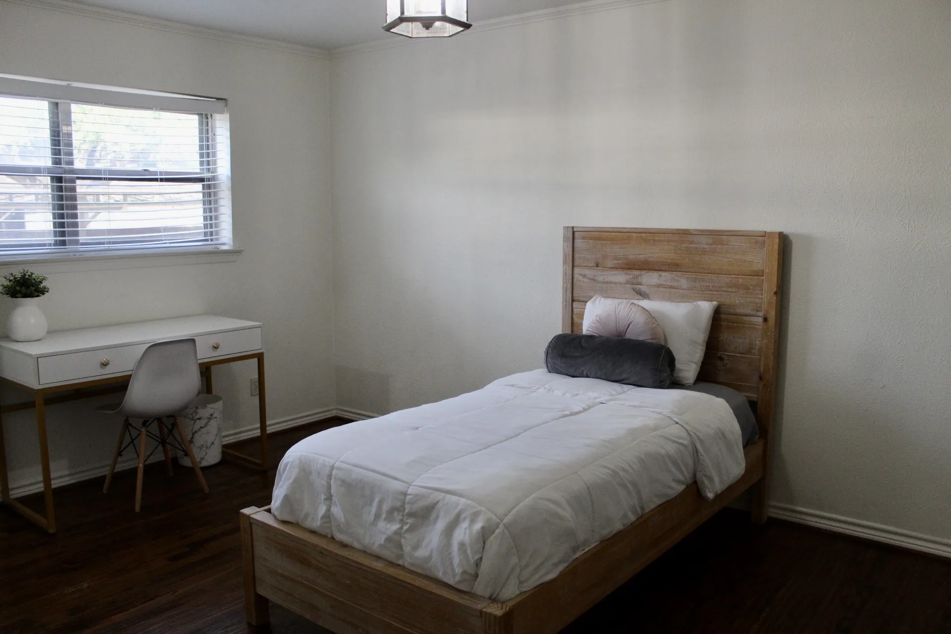 Bedroom with dark wood-type flooring and ornamental molding