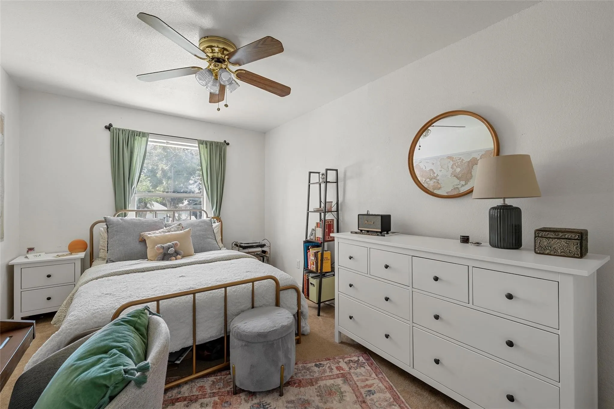 Bedroom with carpet floors and a ceiling fan