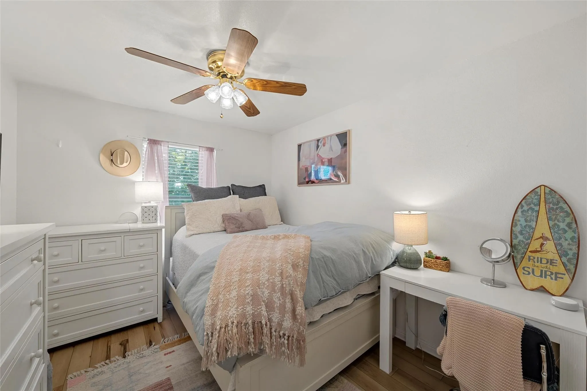 Bedroom featuring dark wood-style flooring and a ceiling fan