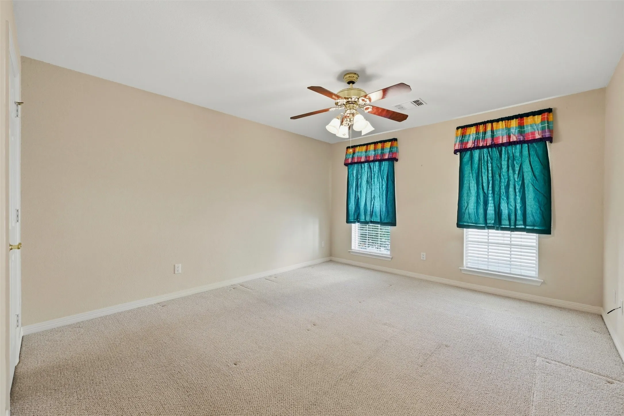 2nd floor Bedroom with carpet flooring and ceiling fan