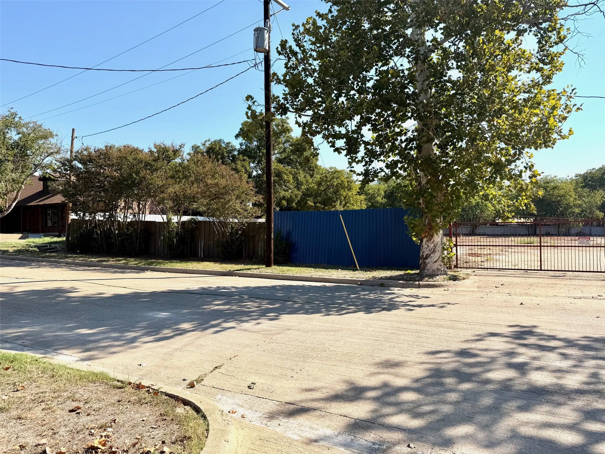 View of concrete road with curbs