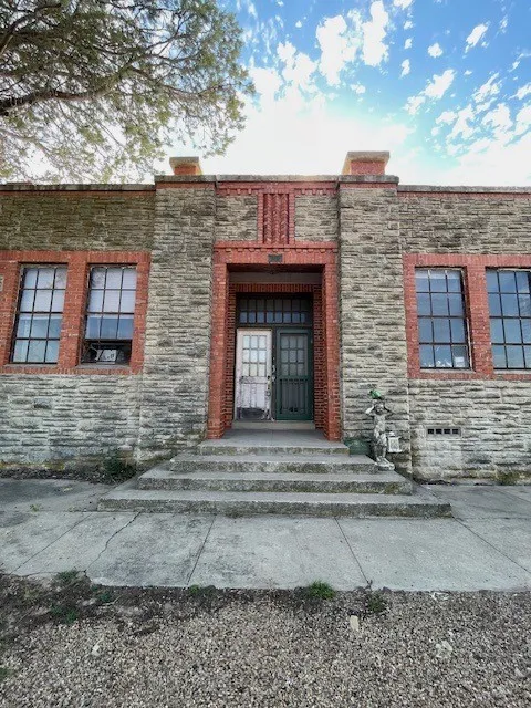 Property entrance with stone siding