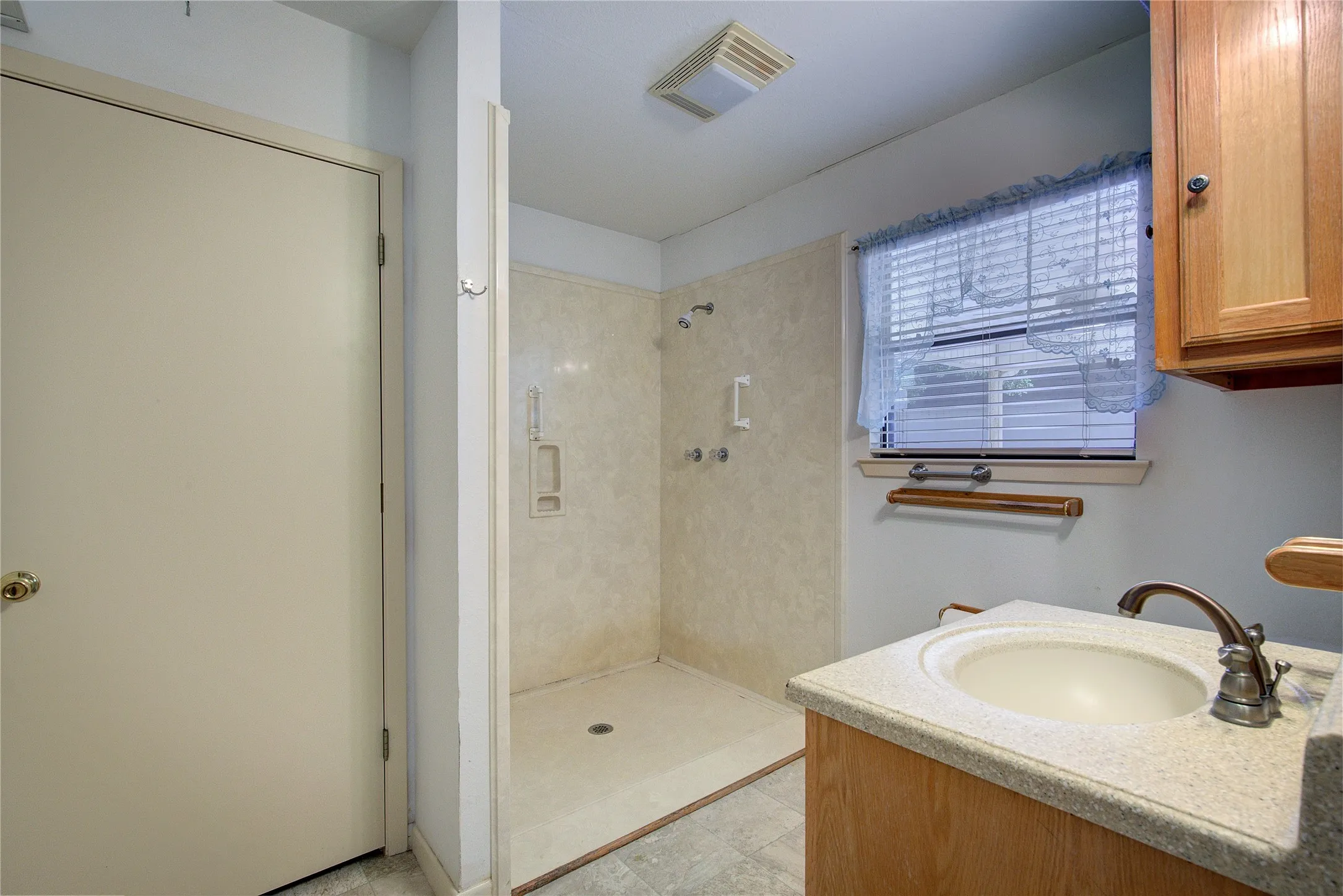 Hall bath has step-in shower and linen closet.
