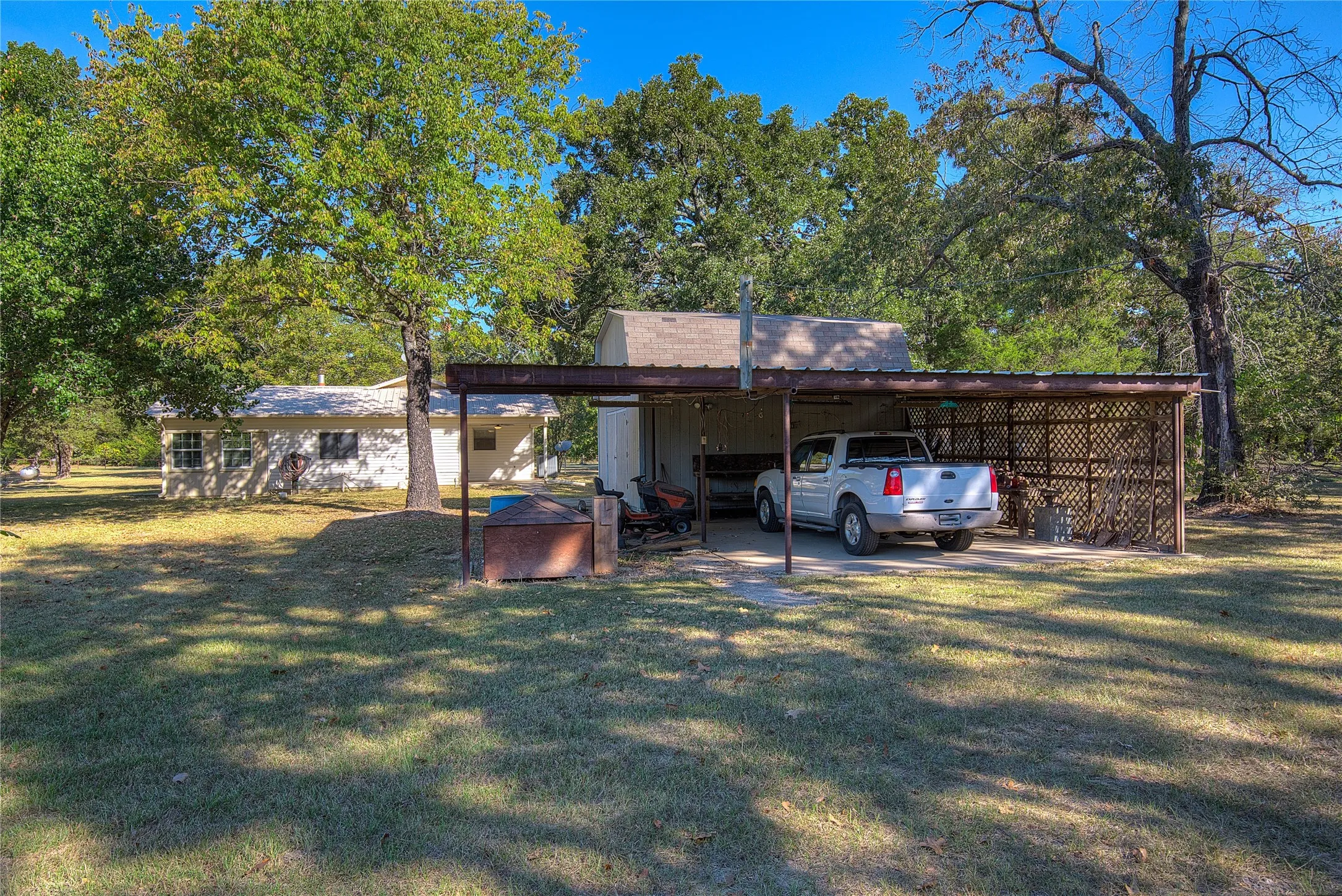 3-car carport attached to 20x16 wood workshop