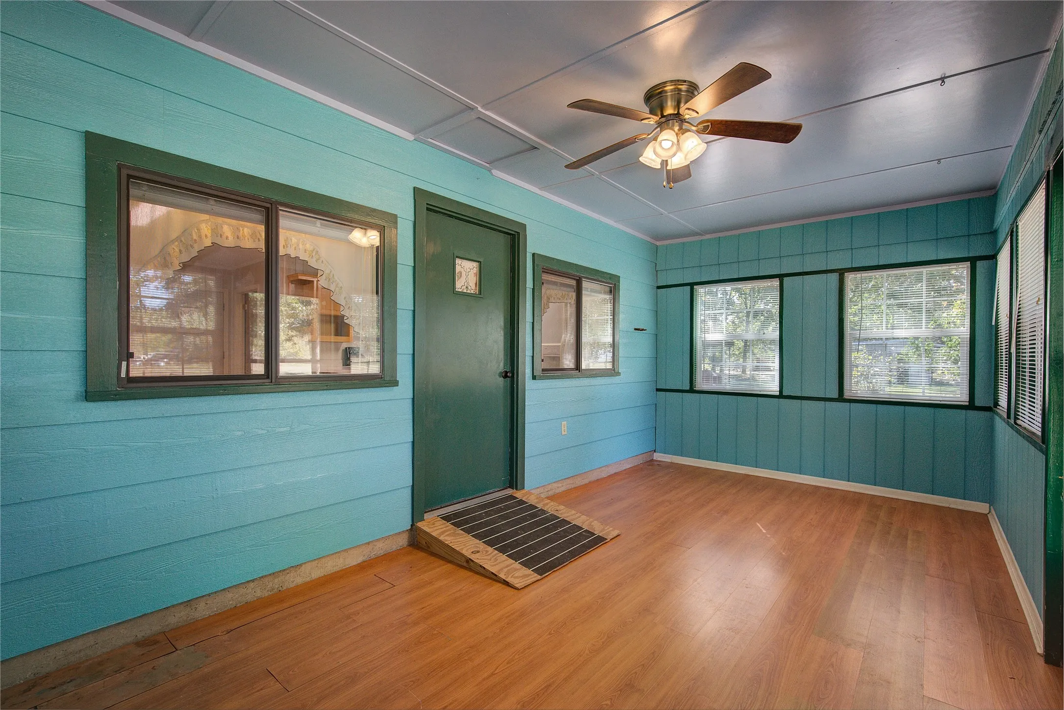 Sun room off of kitchen.