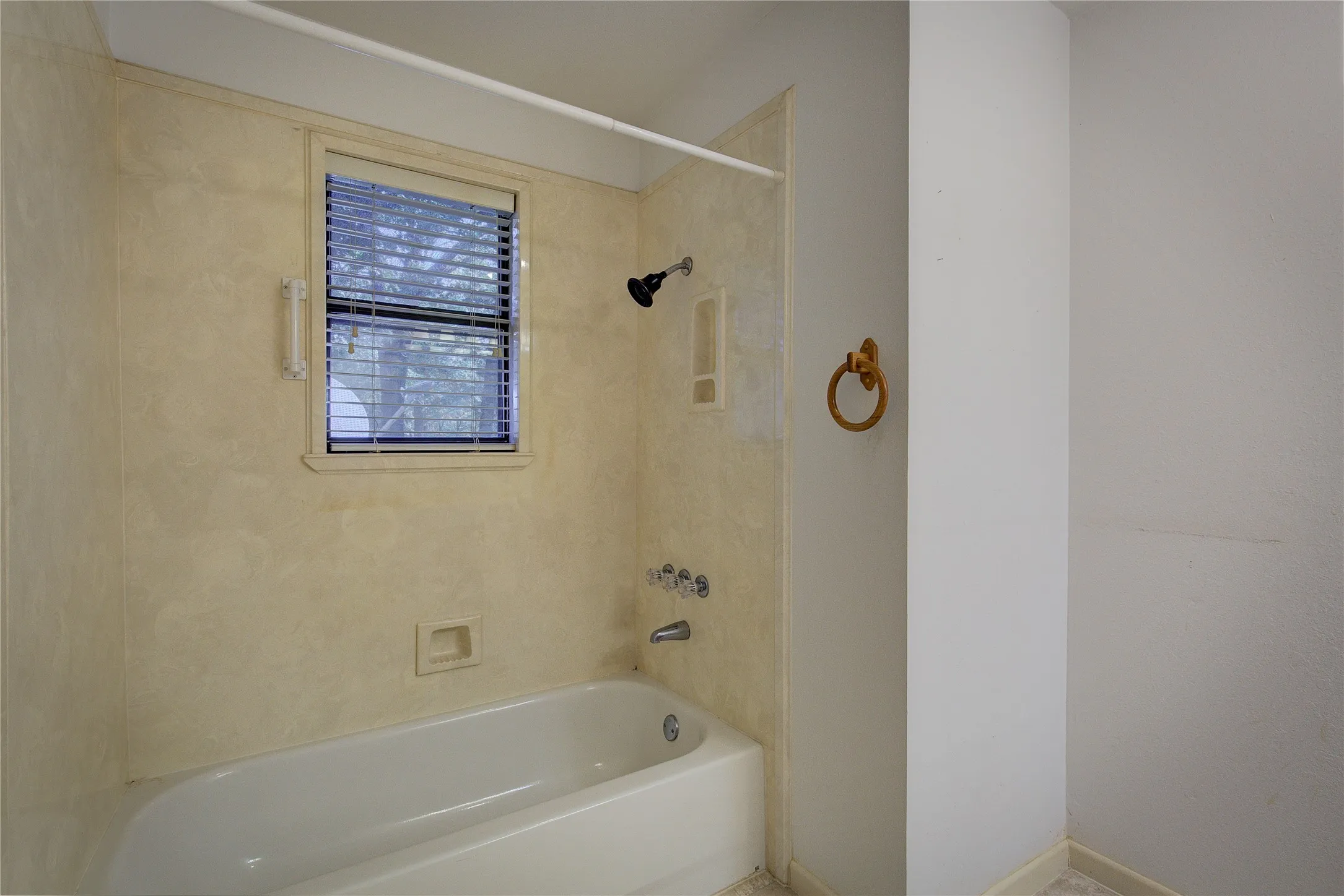 Primary bath has tub/shower surround