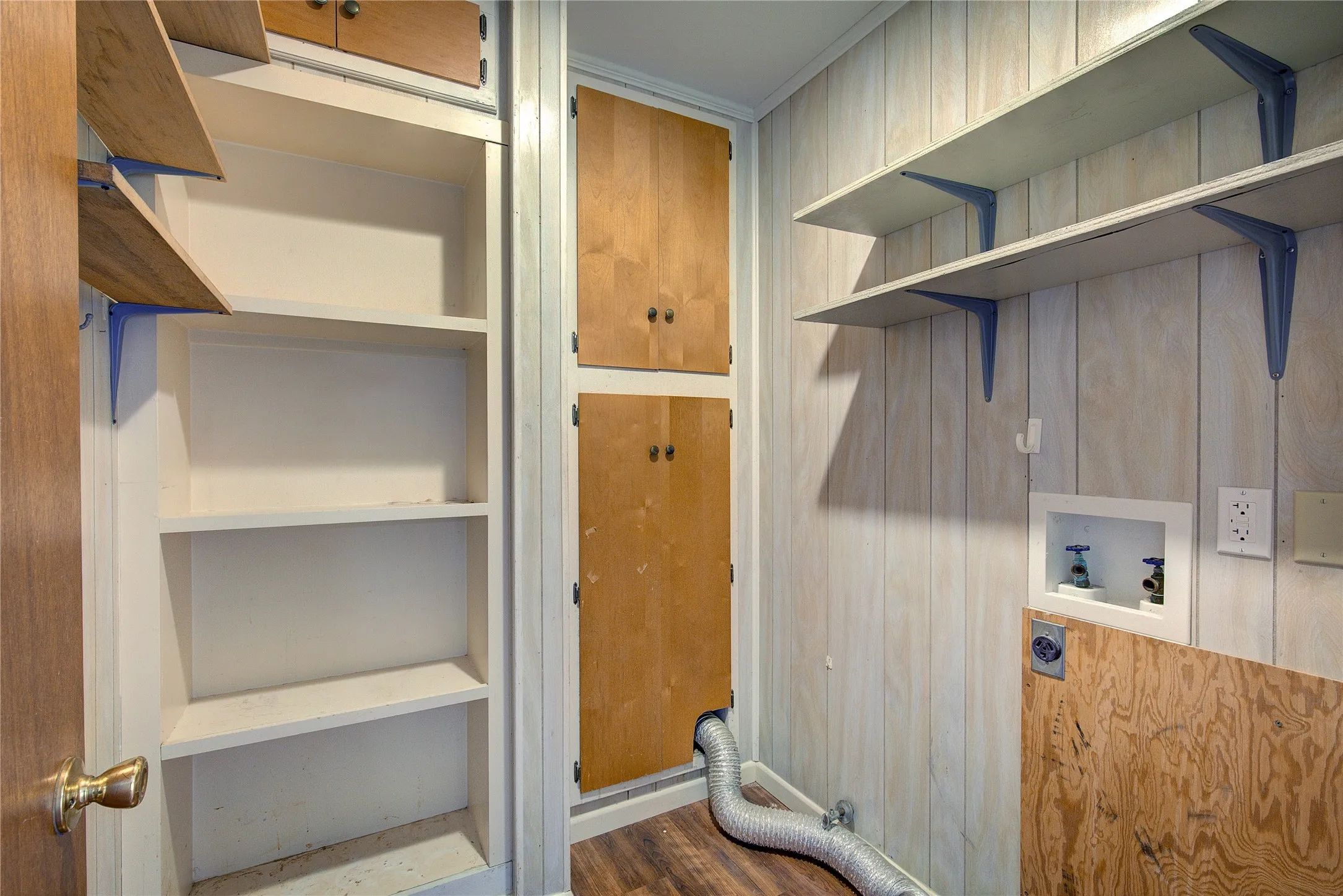 Utility room has space for w/d, second water heater, pantry shelving