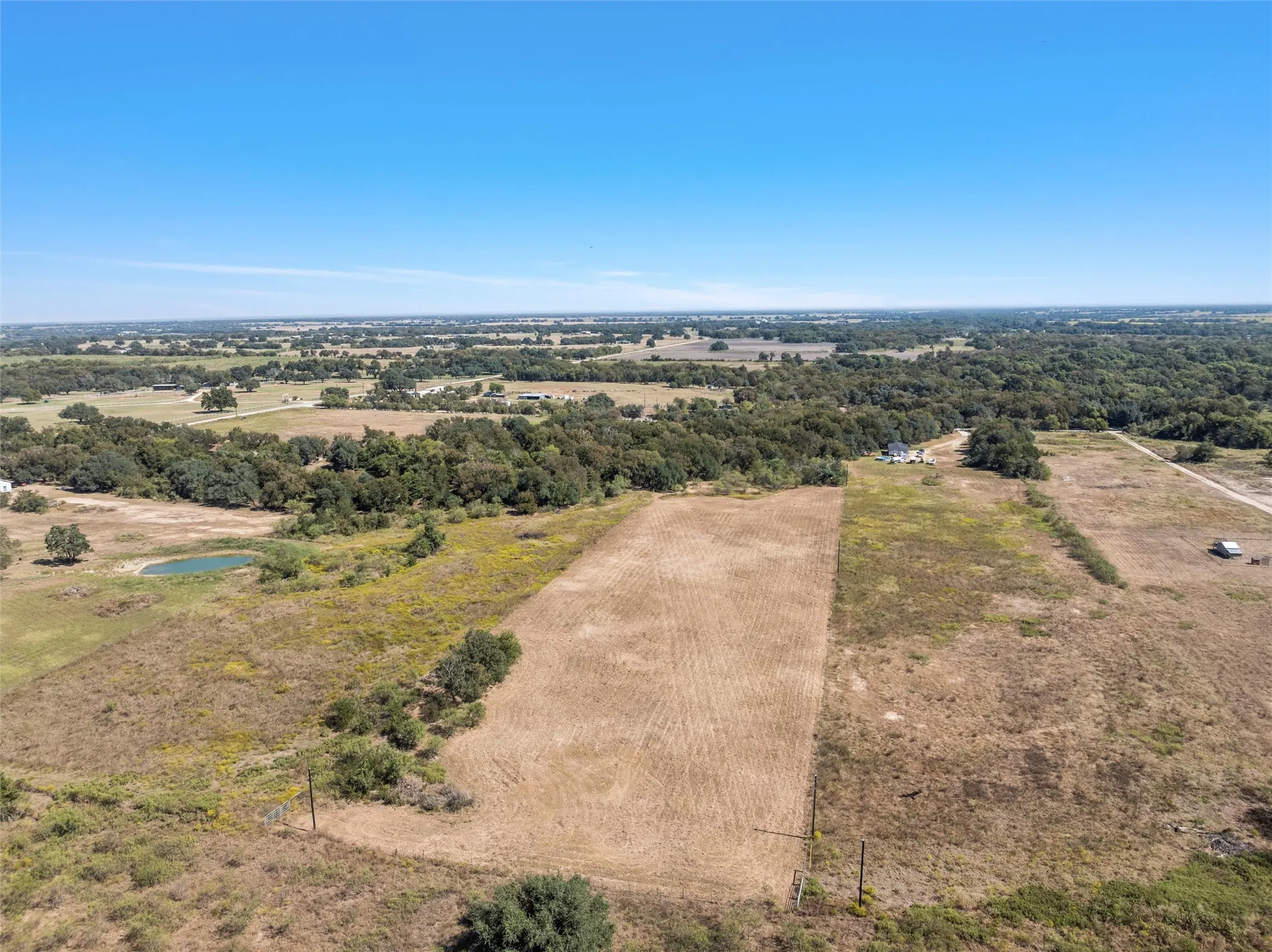 Aerial view of sparsely populated area featuring a large body of water