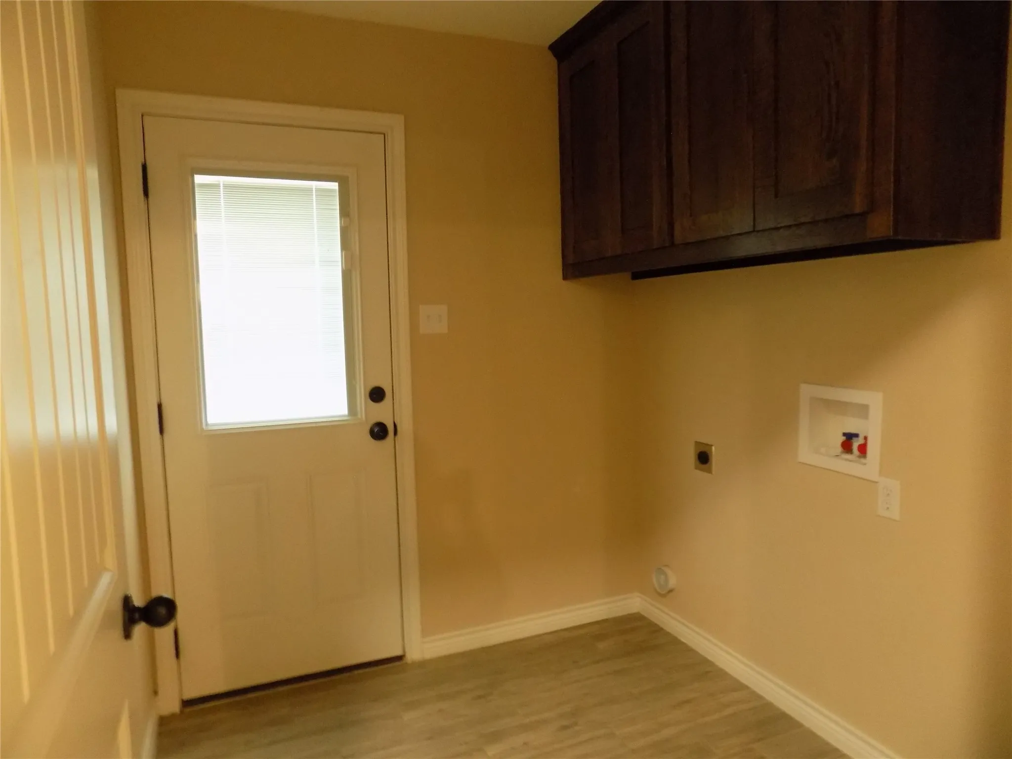 Separate utility room with handy cabinets