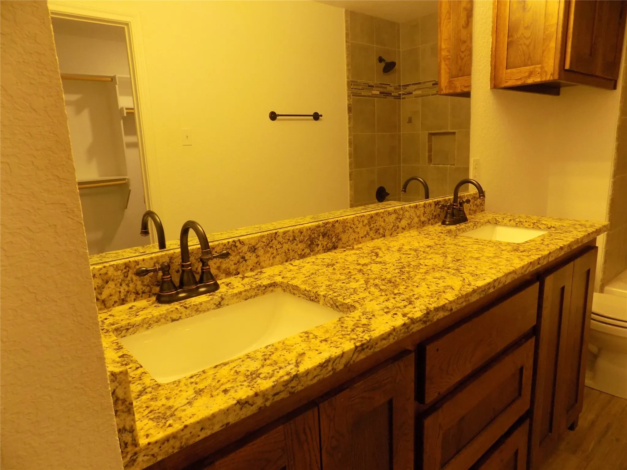 Notice the large sinks and extraordinary granite counter tops