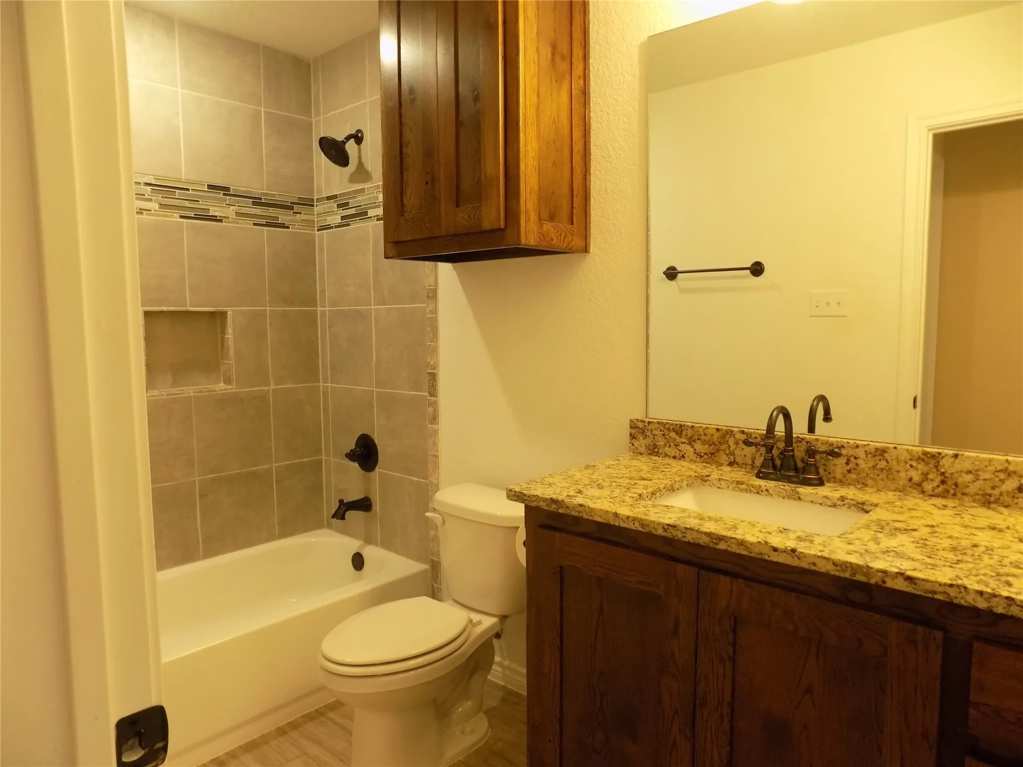Guest bathroom with lovely granite counter tops and tile work