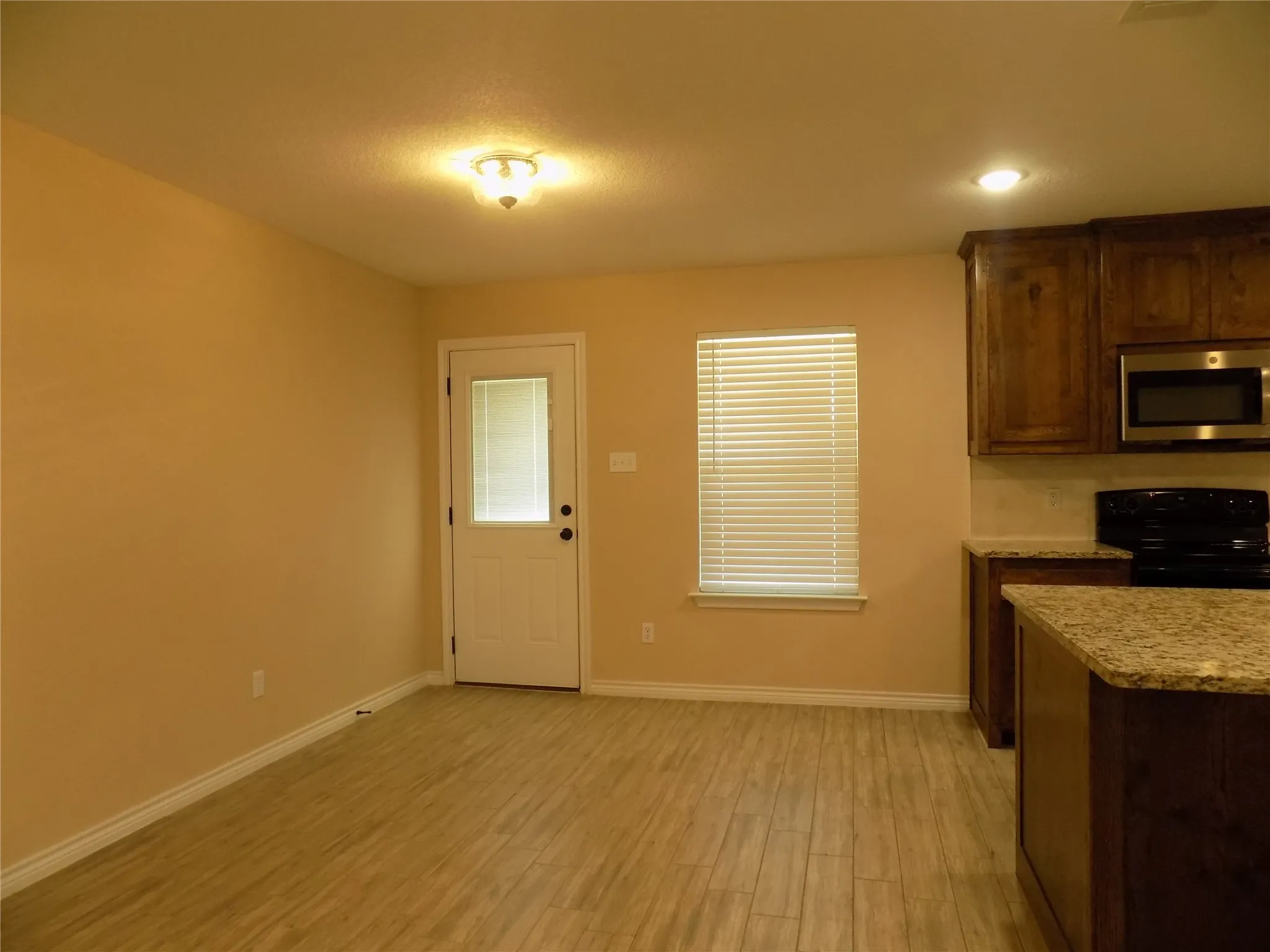 Dining just off kitchen area, as well as in-kitchen eating at island