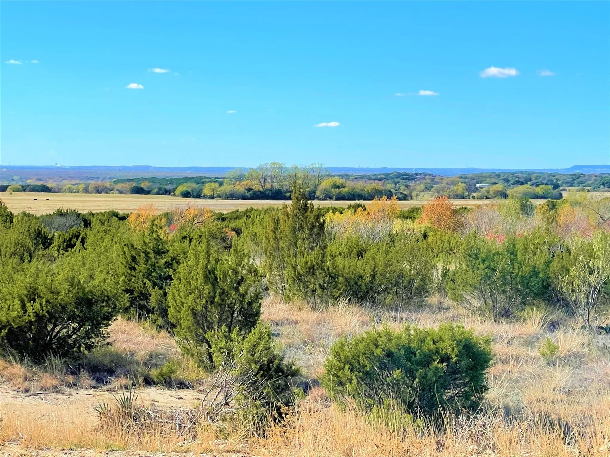 View of mountain backdrop featuring rural landscape