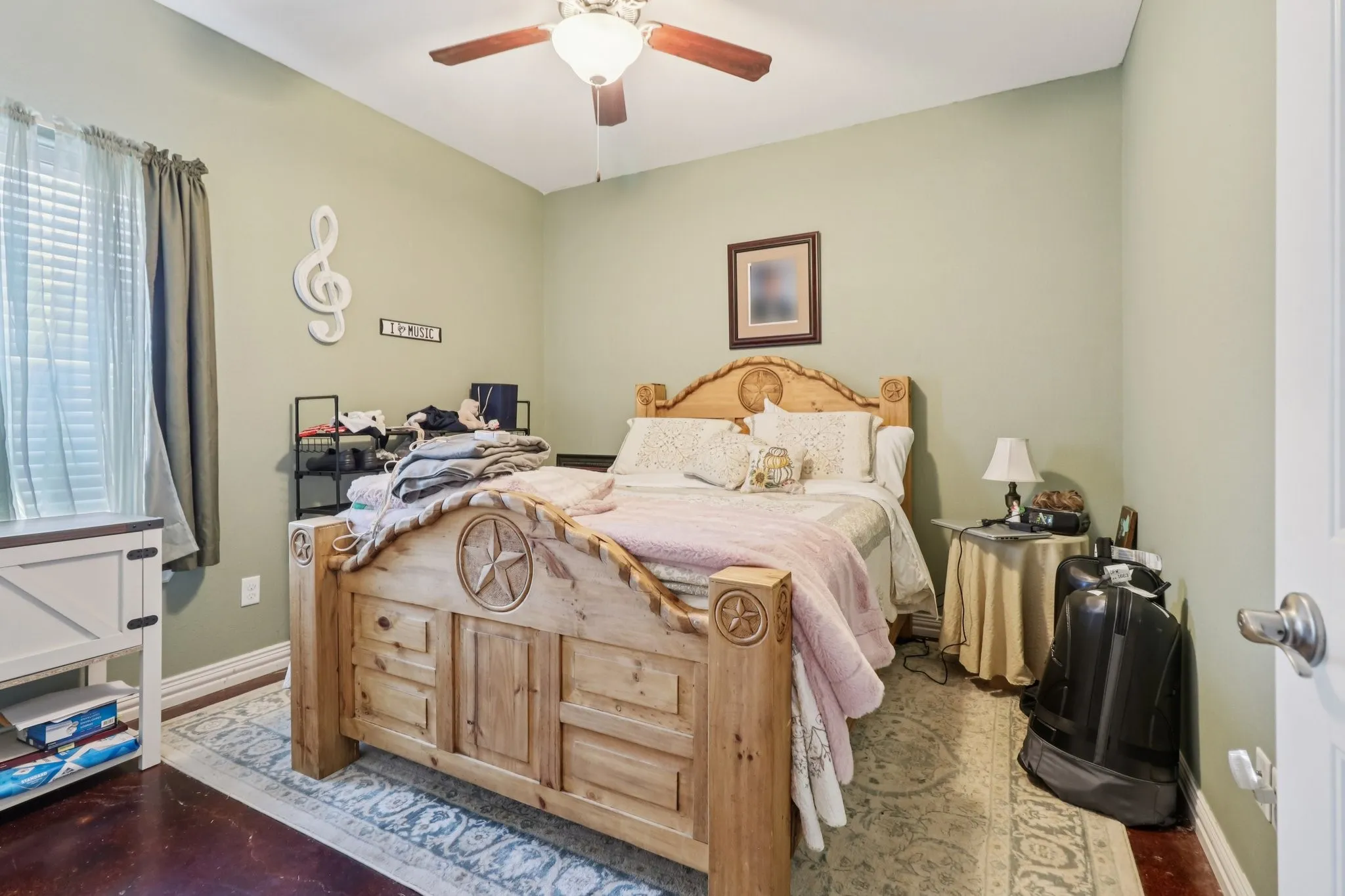Bedroom 3 with stained concrete floors