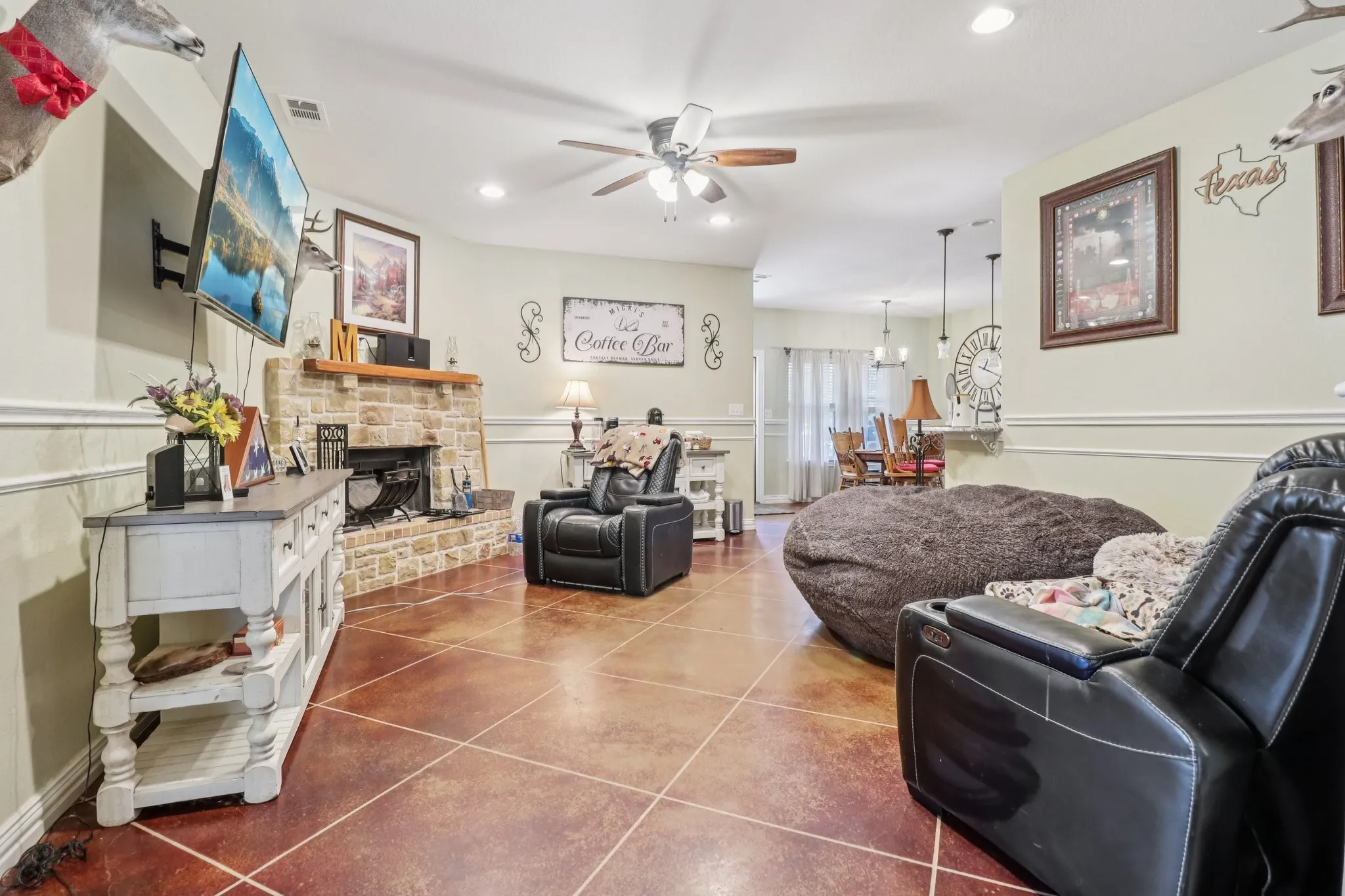 Large living room with concrete flooring