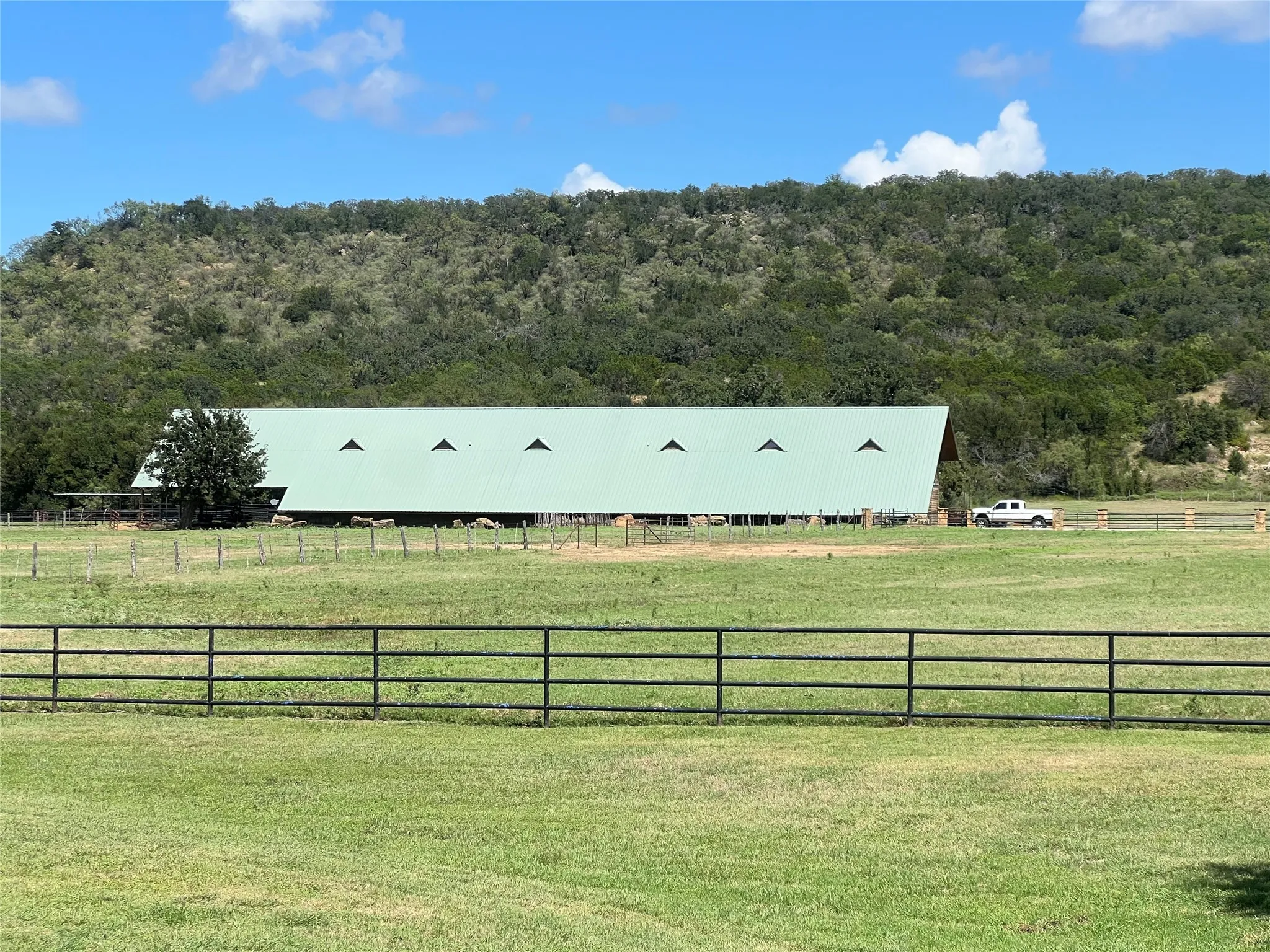 View of the horse barn & stables at 7-R Ranch Community