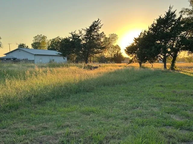 View of yard with a rural view