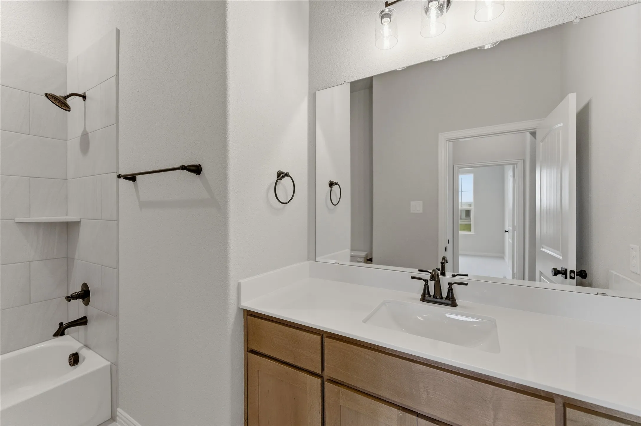 Full bathroom featuring vanity and bathing tub / shower combination