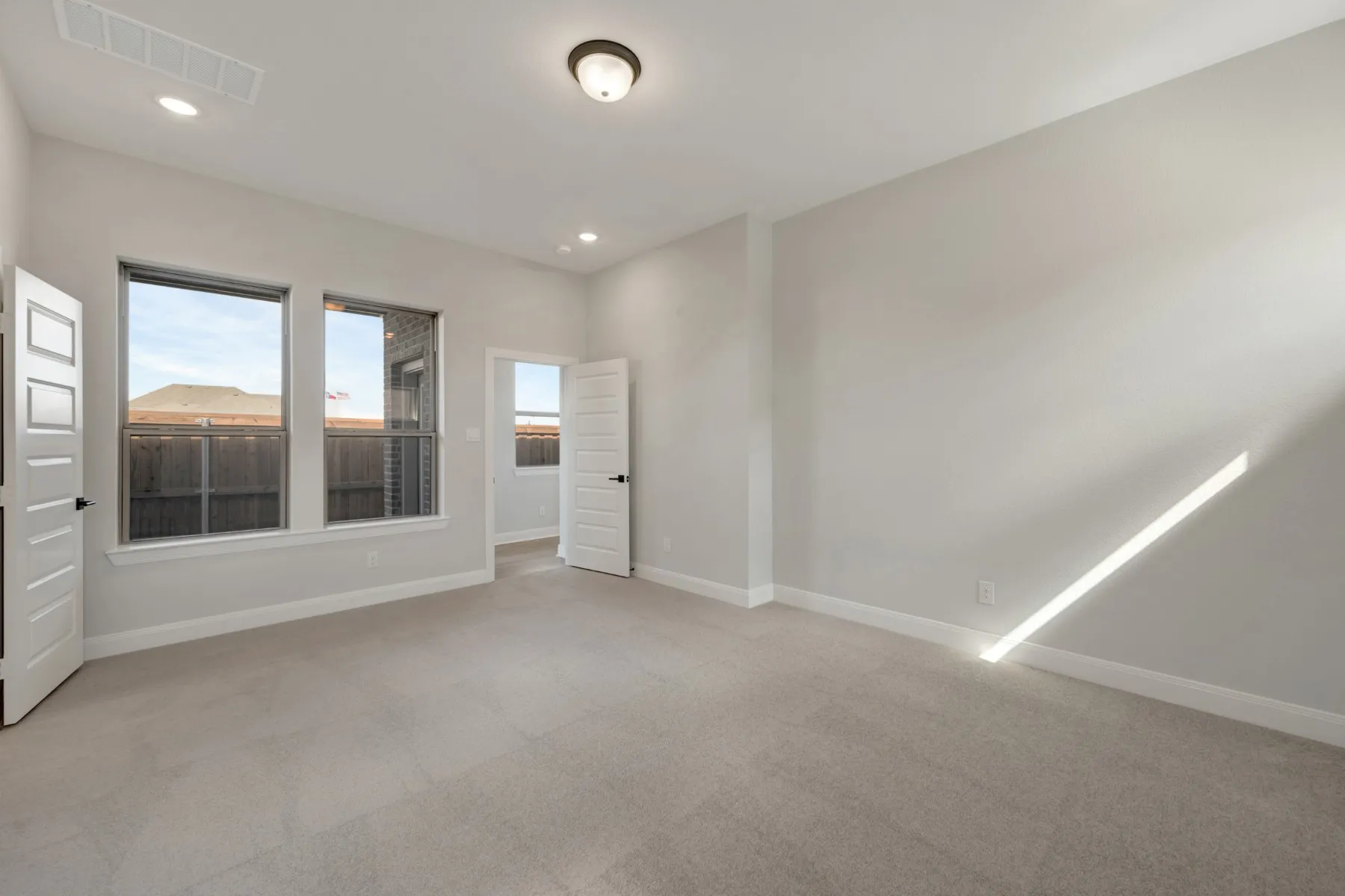 Unfurnished room featuring light carpet and recessed lighting