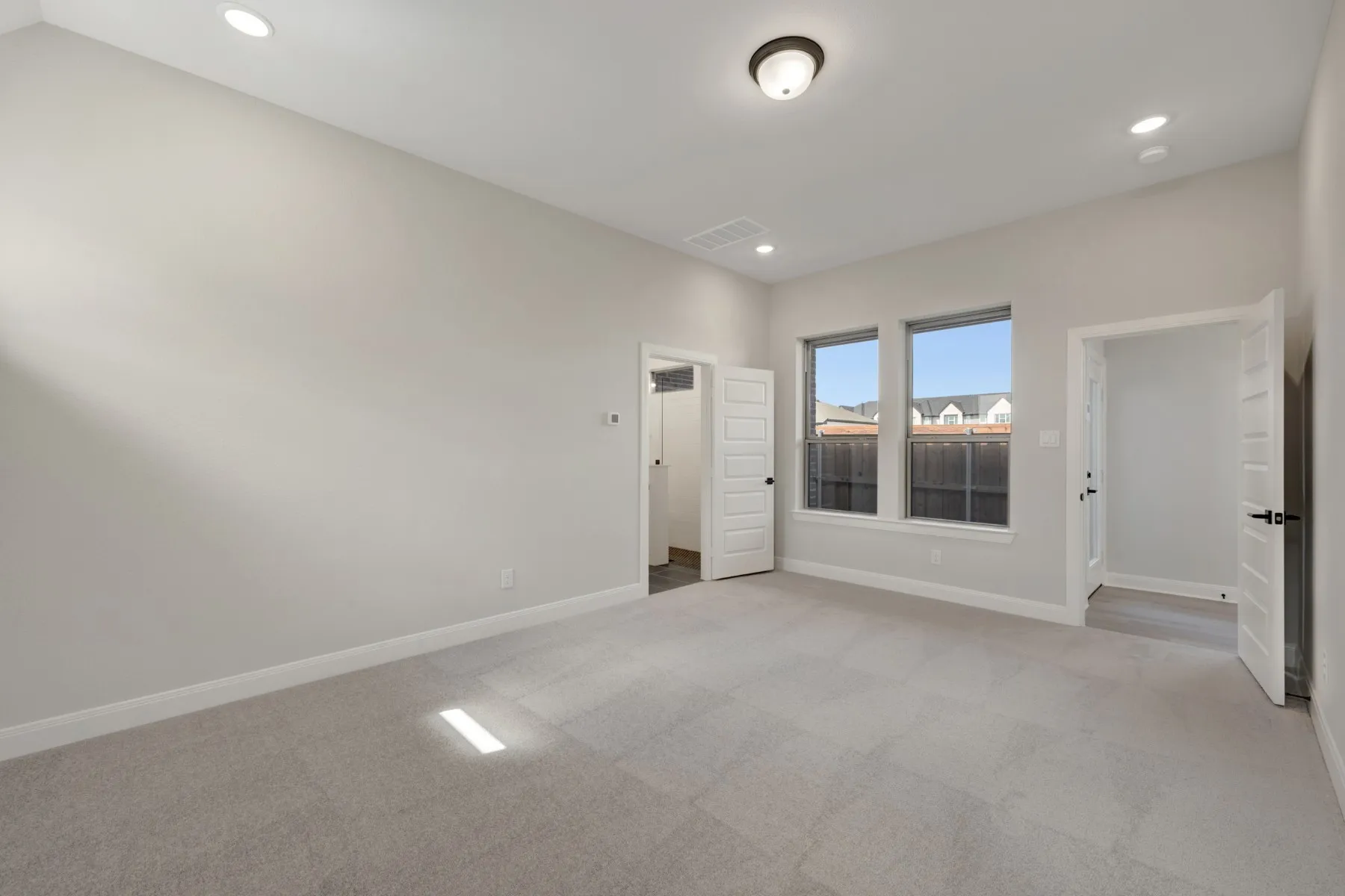 Unfurnished room featuring light carpet and recessed lighting