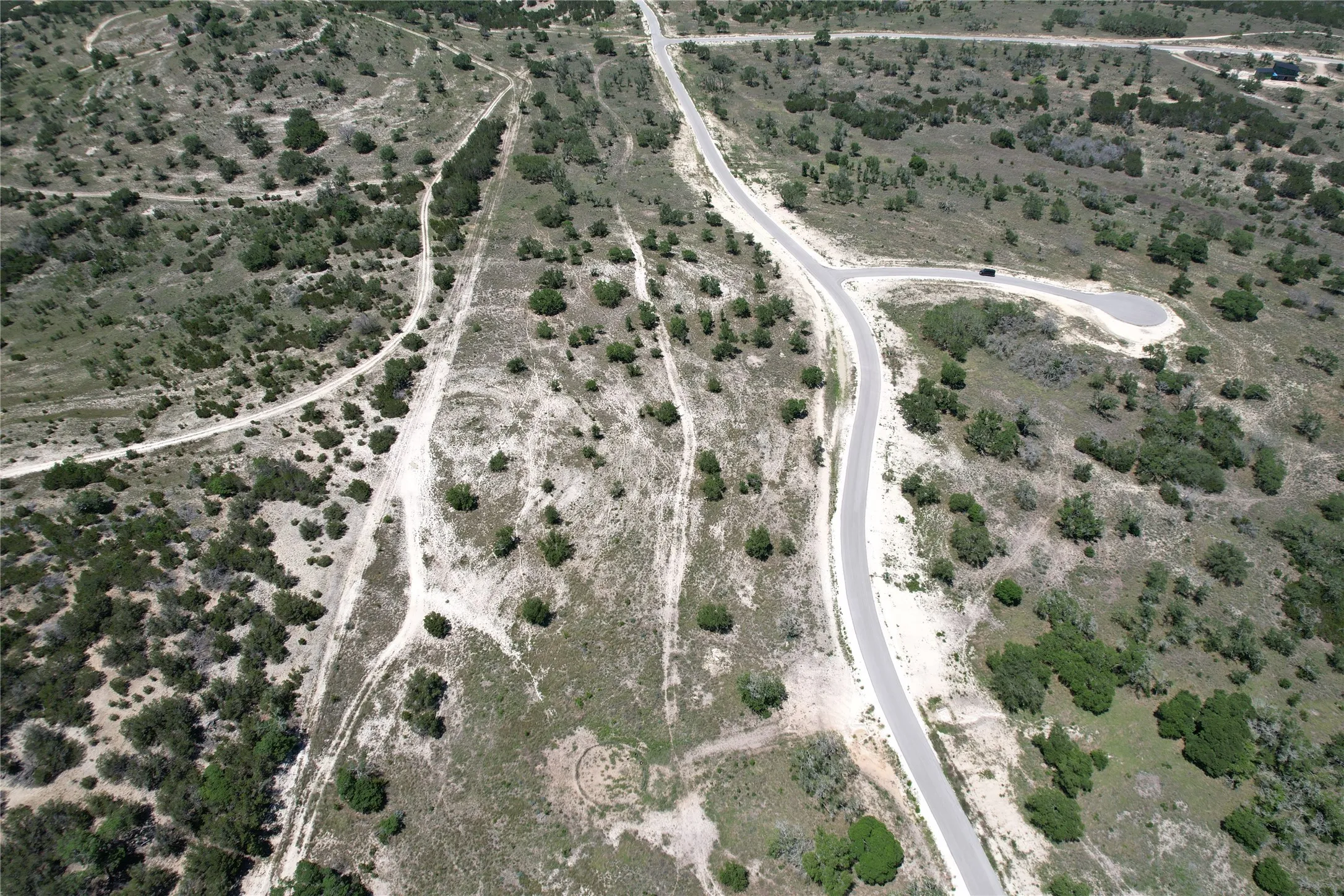 Aerial view of property and surrounding area featuring rural landscape