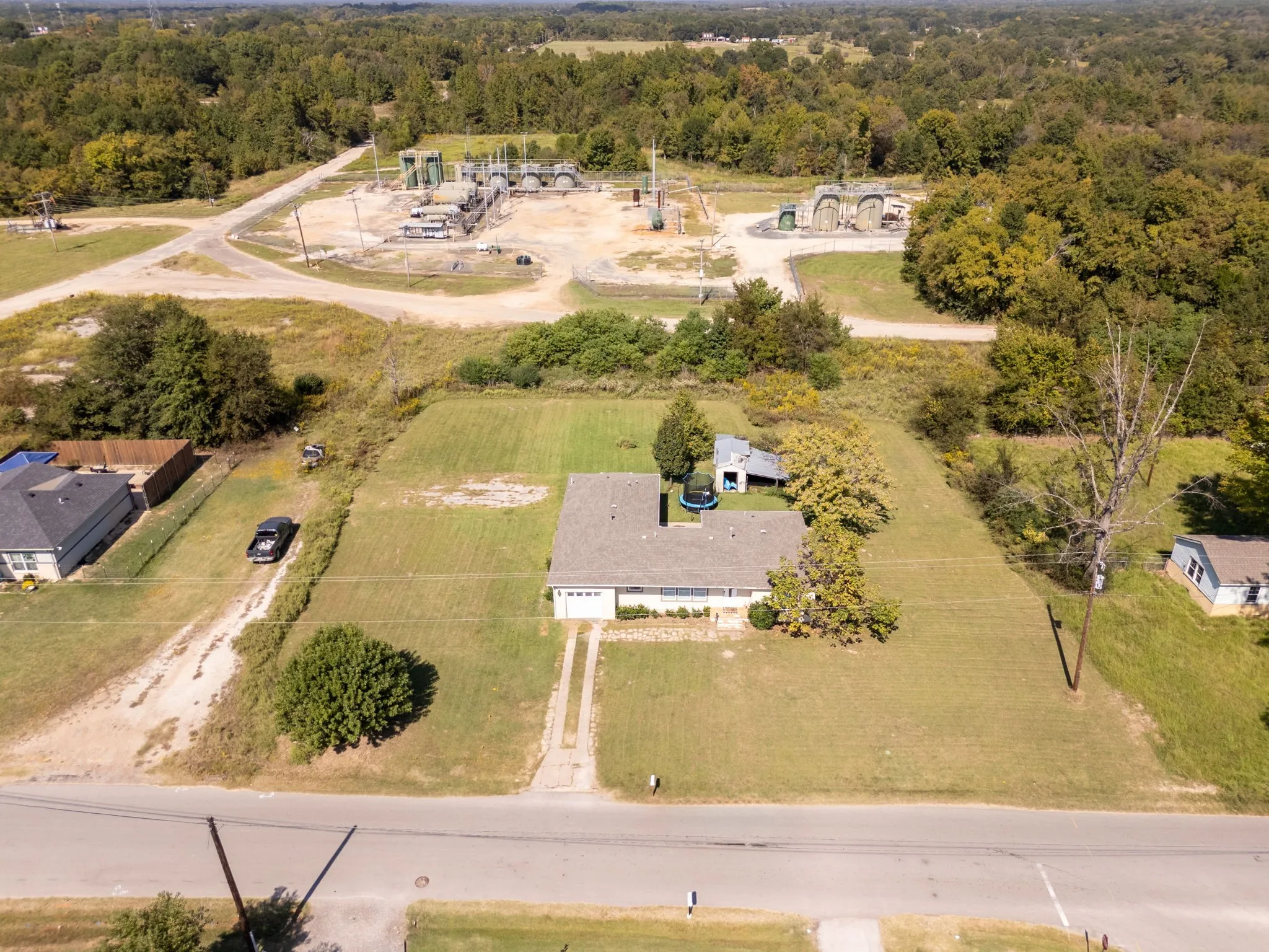 View of property location featuring a heavily wooded area