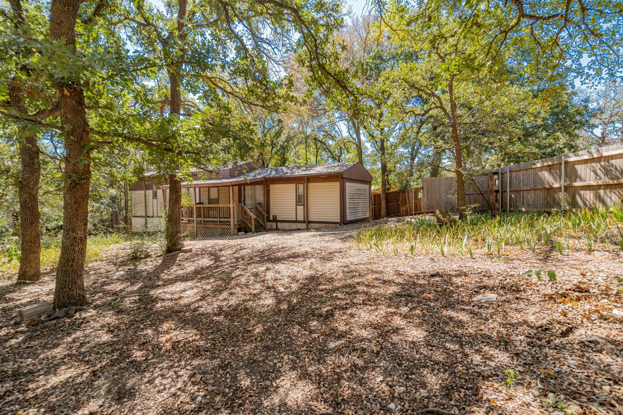View of yard featuring a wooden deck