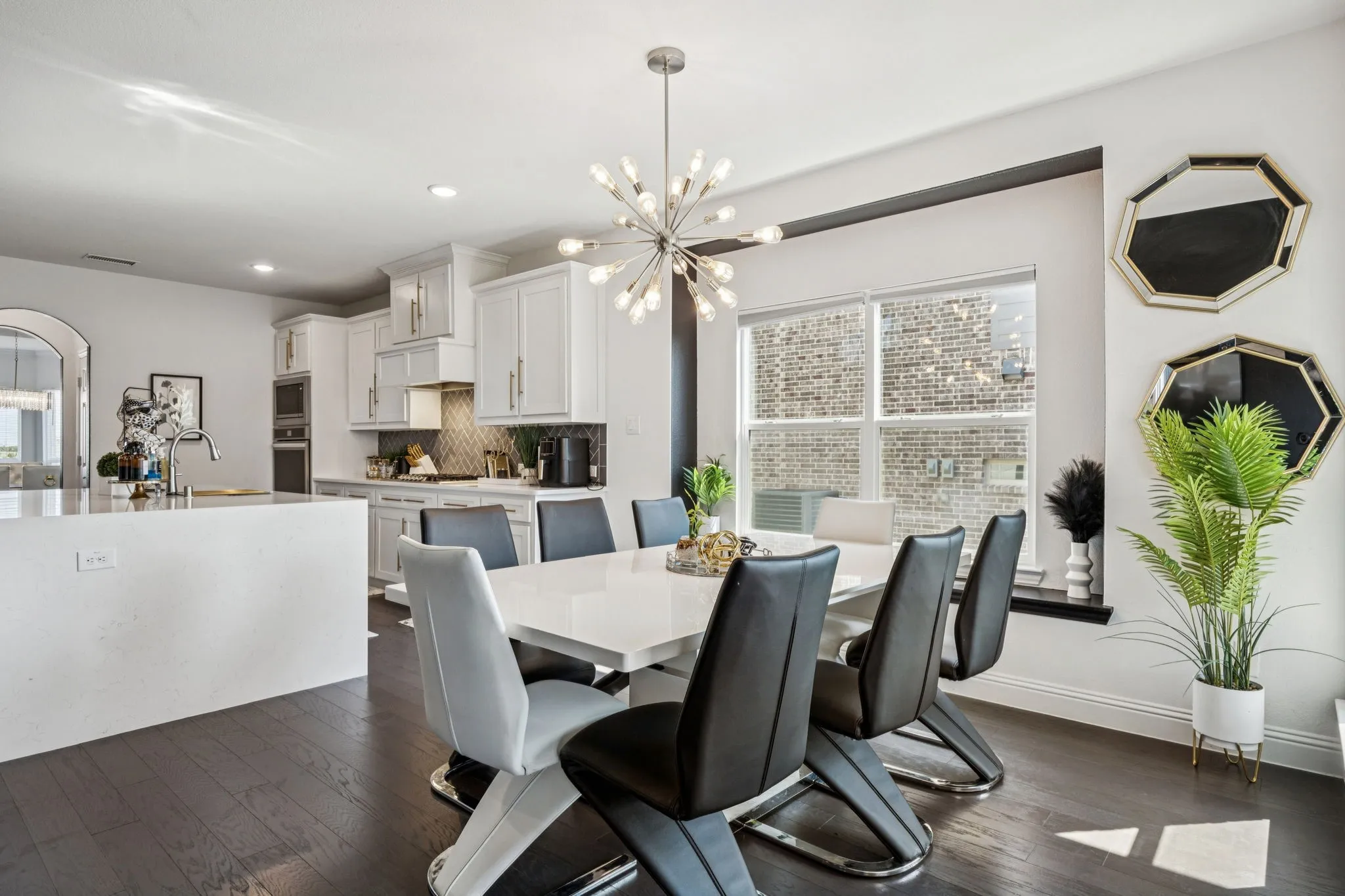 Dining space featuring dark wood-style floors, recessed lighting, arched walkways, and a chandelier