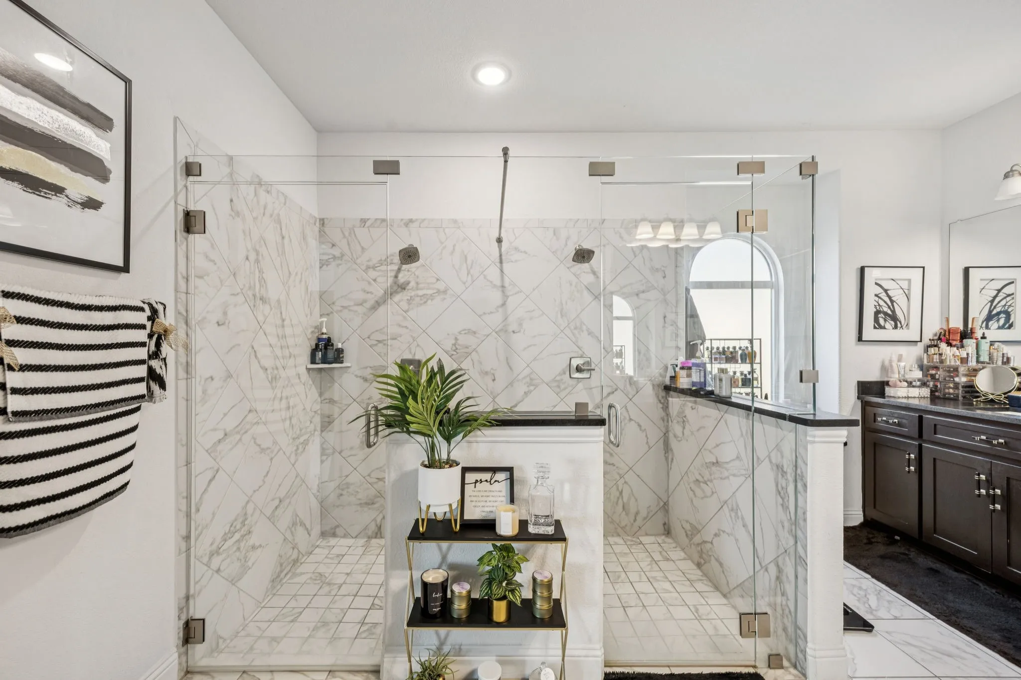 Bathroom featuring vanity and a stall shower