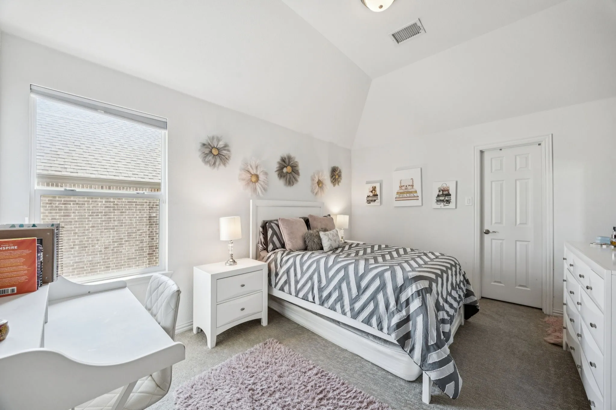 Carpeted bedroom featuring lofted ceiling
